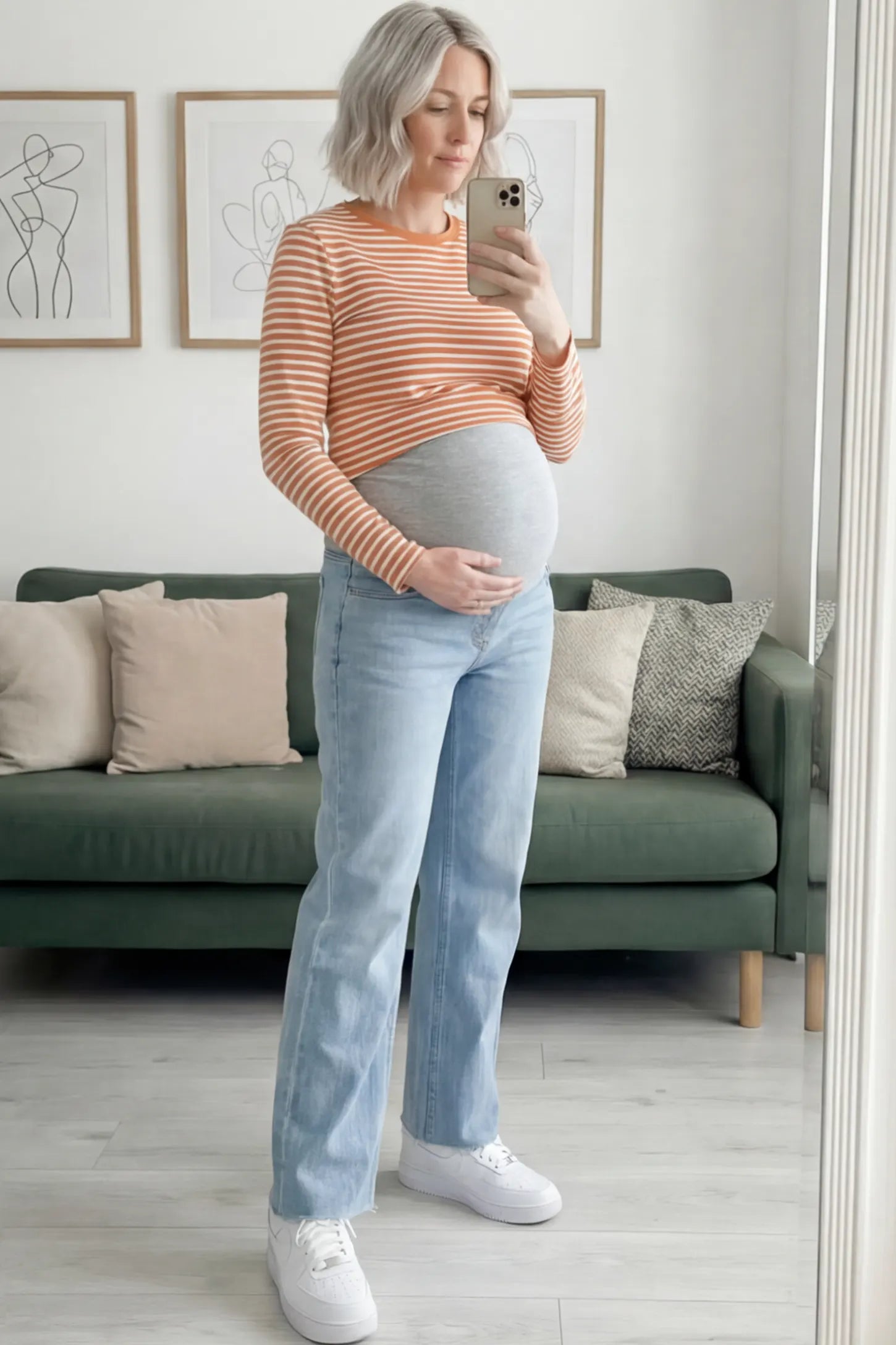 Full Panel Wide Leg Maternity Jeans Full Panel Wide Leg Maternity Jeans in Light Blue featuring a seamless tummy-support band on a pregnant woman facing front.