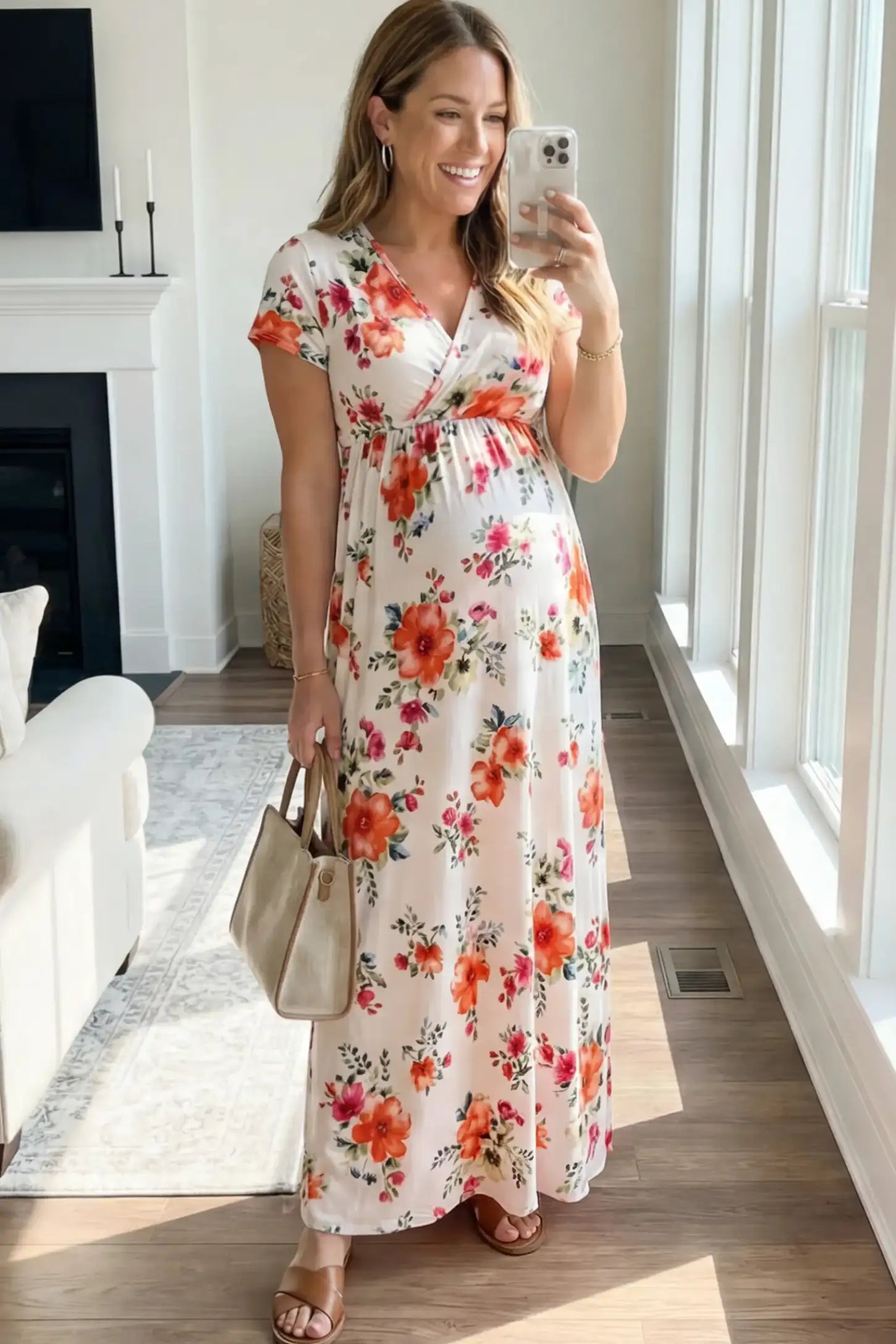 Floral Print V-Neck Maternity Maxi Dress Floral Print V-Neck Maternity Maxi Dress in White featuring a vibrant floral pattern on a pregnant model.
