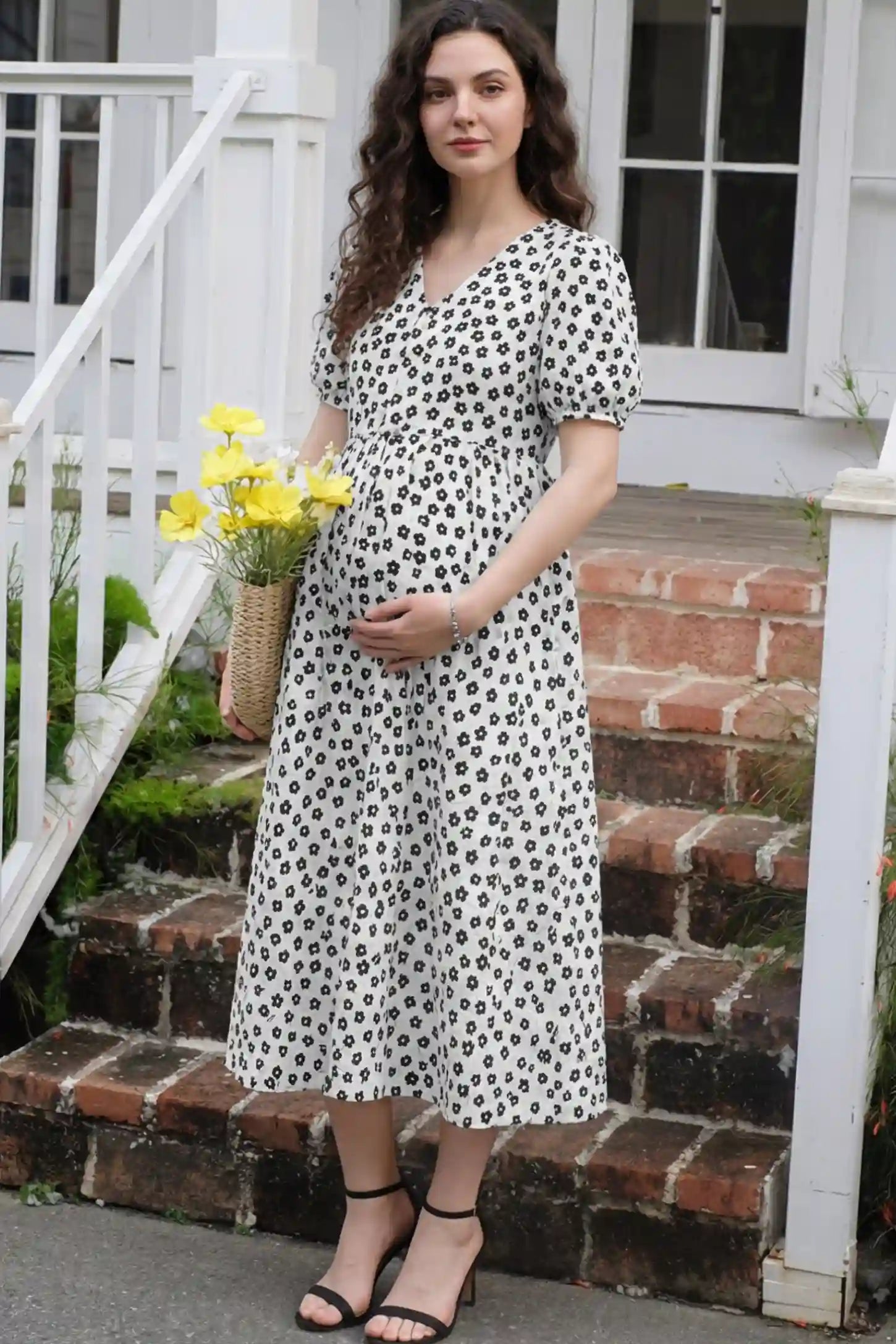 Floral V-Neck Short Sleeve Maternity Nursing Dress Floral Print V-Neck Maternity Nursing Dress in Black featuring functional button-front details on a pregnant model.
