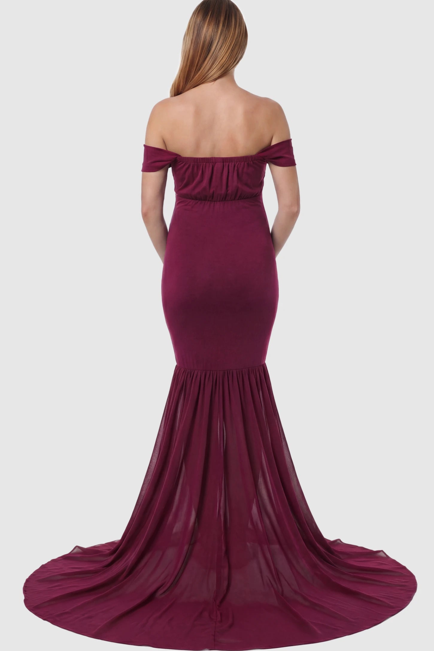 Solid Off Shoulder Mermaid Maternity Photoshoot Gown Off Shoulder Mermaid Maternity Photoshoot Gown in Burgundy featuring a dramatic chiffon train on a pregnant model.