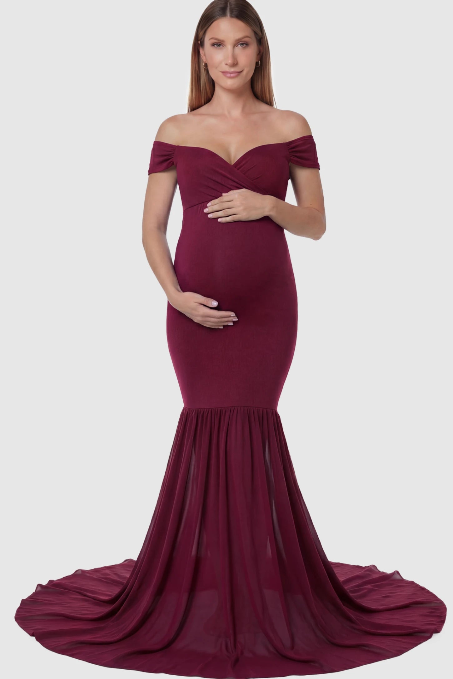 Solid Off Shoulder Mermaid Maternity Photoshoot Gown Off Shoulder Mermaid Maternity Photoshoot Gown in Burgundy featuring a dramatic chiffon train on a pregnant model.