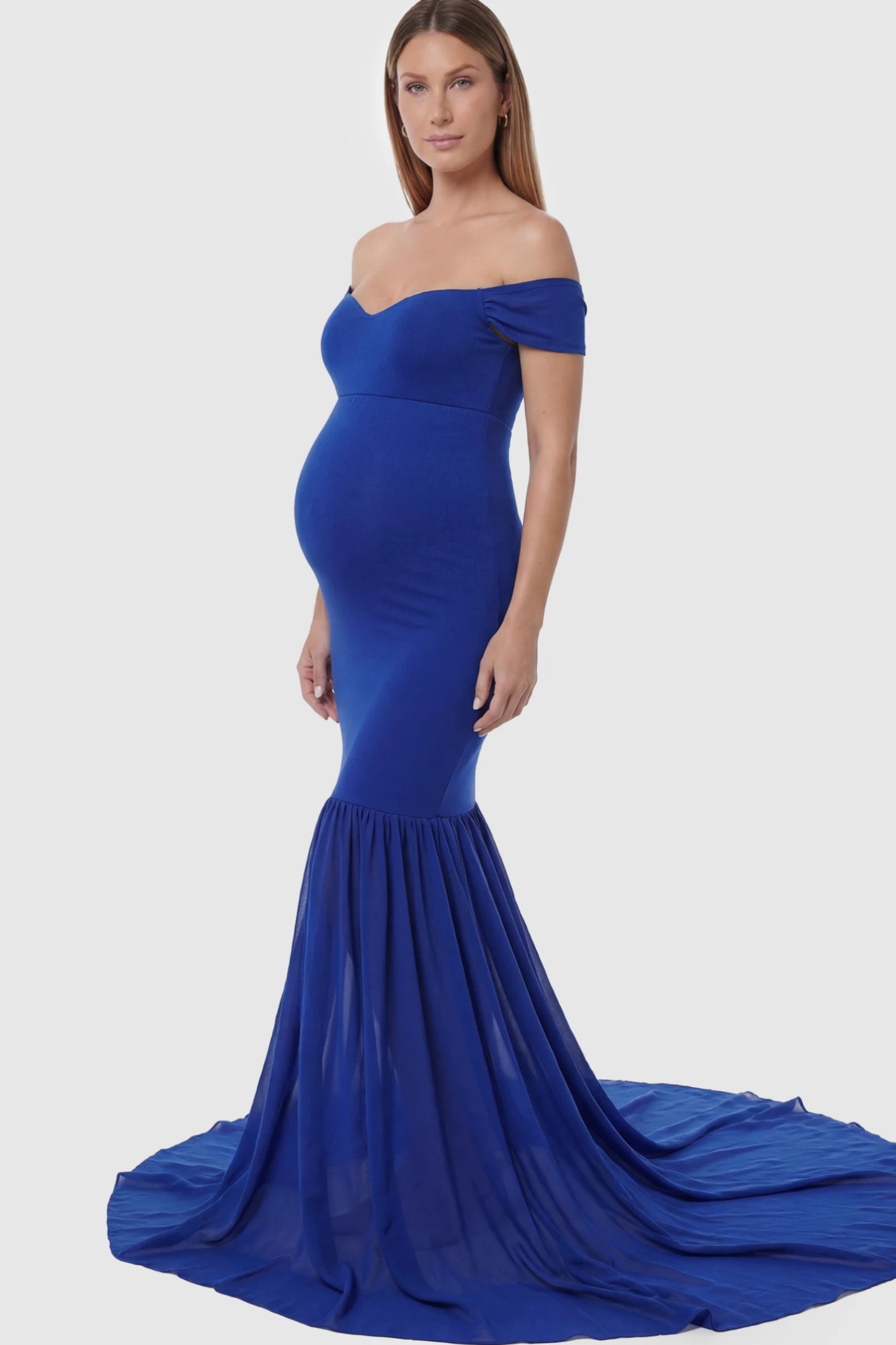 Solid Off Shoulder Mermaid Maternity Photoshoot Gown Off Shoulder Mermaid Maternity Photoshoot Gown in Dark Blue featuring a dramatic chiffon train on a pregnant model.