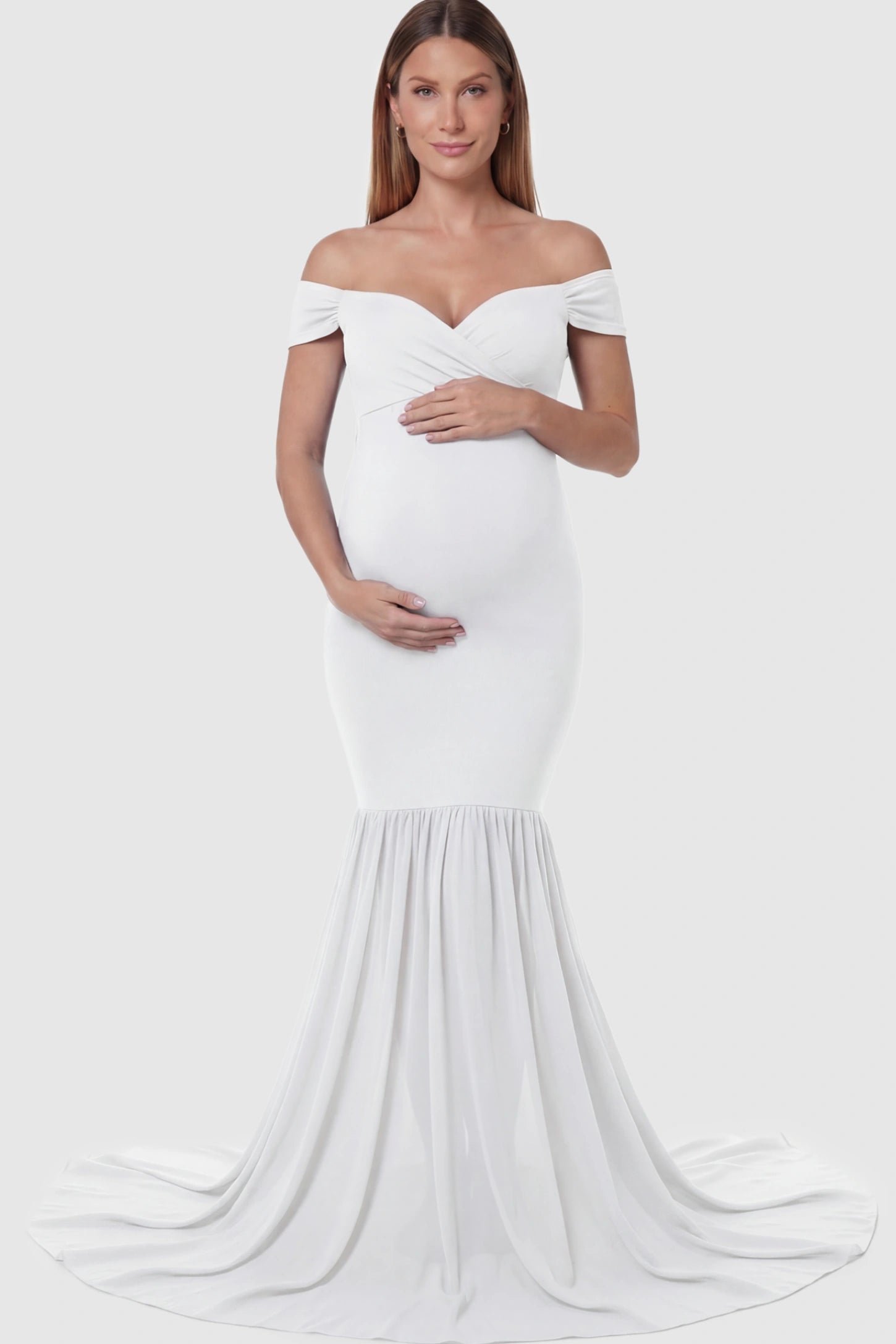 Solid Off Shoulder Mermaid Maternity Photoshoot Gown Off Shoulder Mermaid Maternity Photoshoot Gown in White featuring a dramatic chiffon train on a pregnant model.