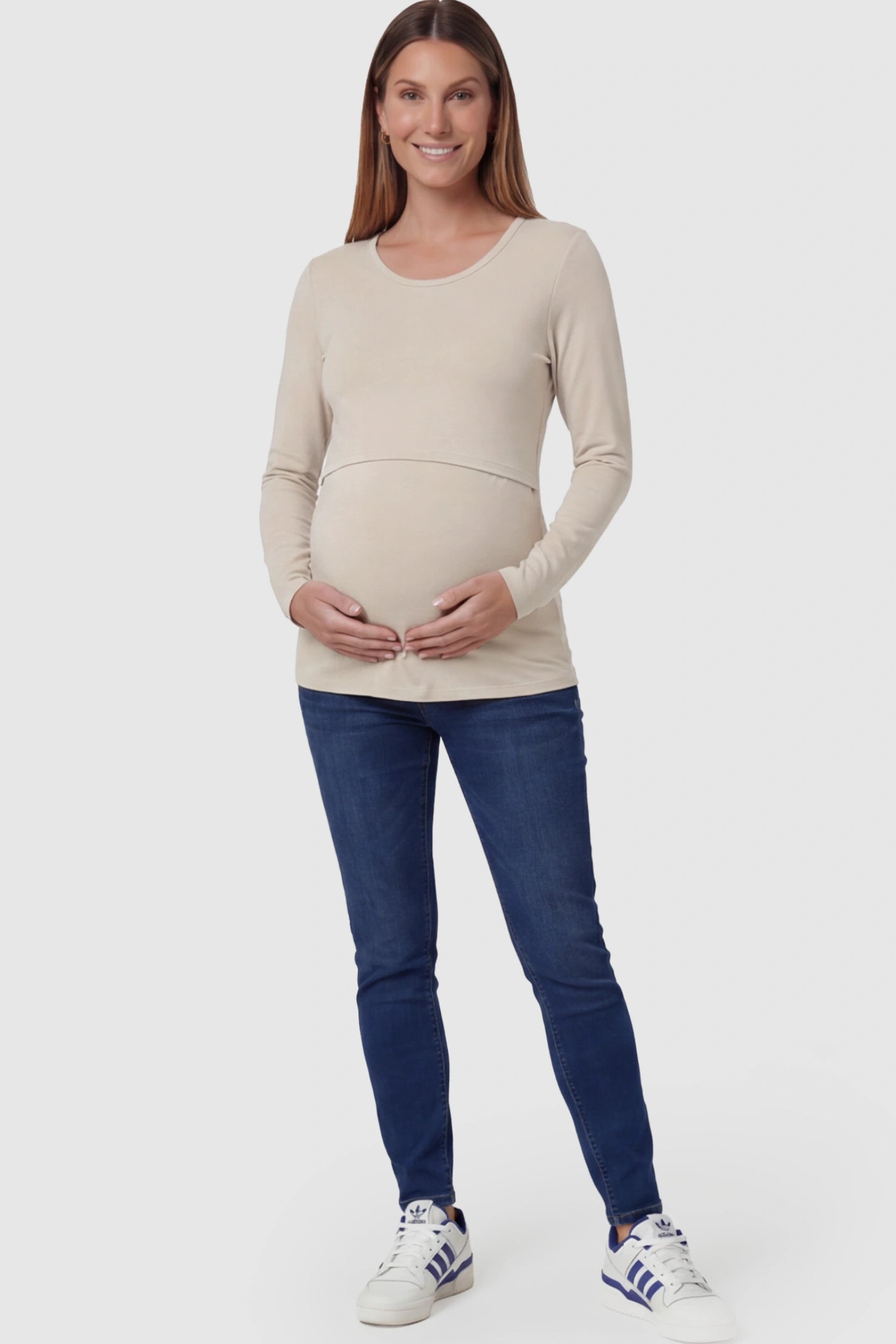 Double Layer Long Sleeve Maternity Nursing Top Double Layer Long Sleeve Maternity & Nursing Top in Apricot with a discrete lift-up access on a pregnant model.