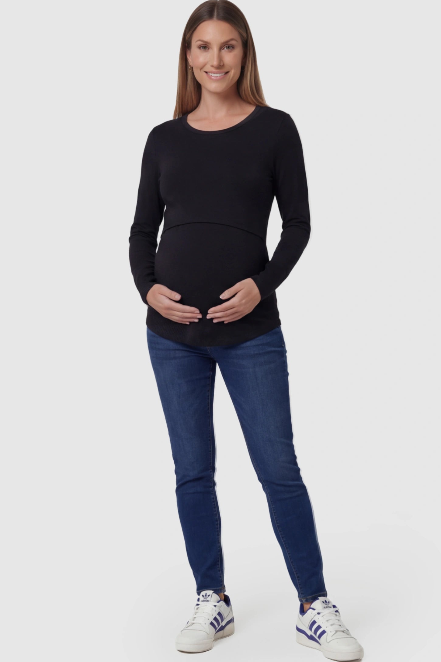 Double Layer Long Sleeve Maternity Nursing Top Double Layer Long Sleeve Maternity & Nursing Top in Black with a discrete lift-up access on a pregnant model.