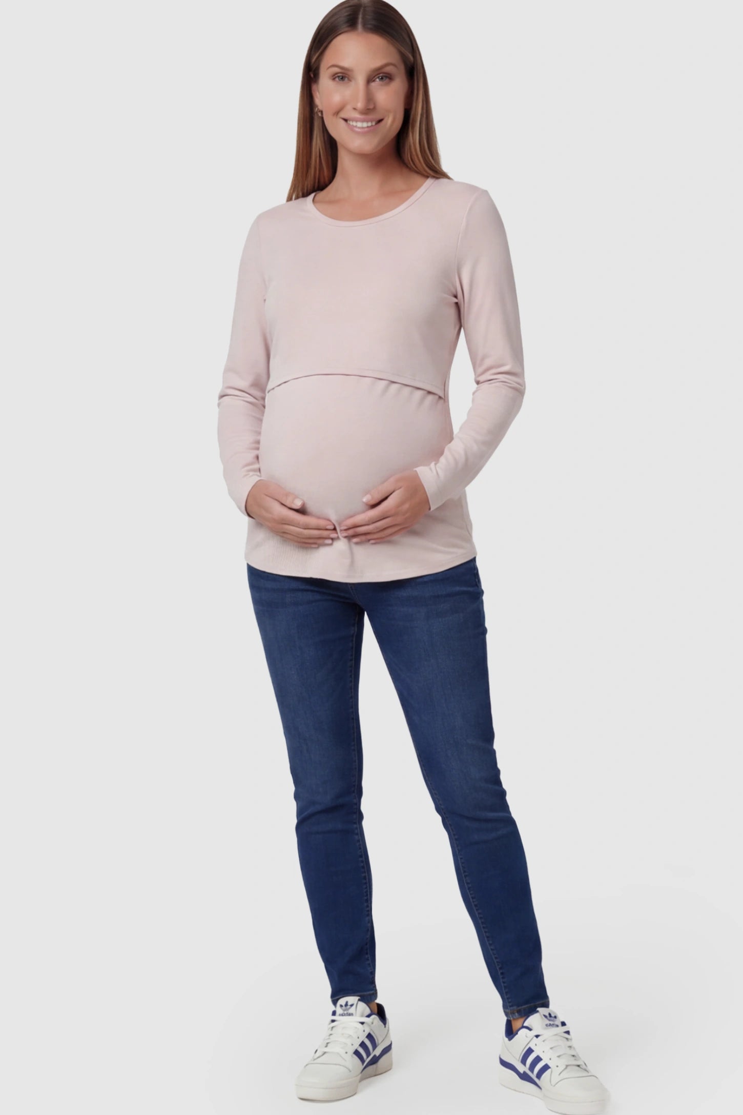 Double Layer Long Sleeve Maternity Nursing Top Double Layer Long Sleeve Maternity & Nursing Top in Pink with a discrete lift-up access on a pregnant model.