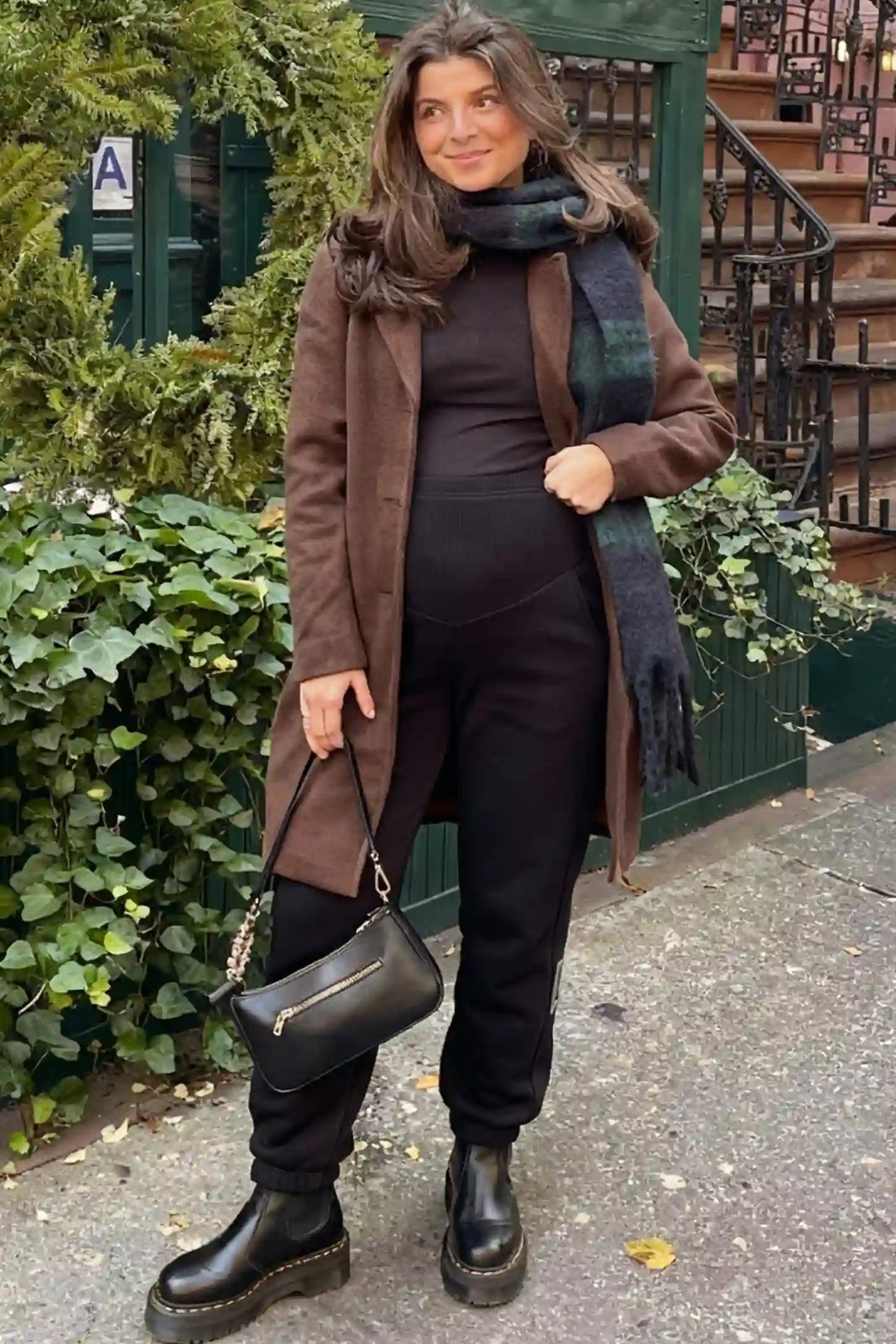 Cotton Blend Full Panel Tapered Leg Maternity Joggers Cotton Blend Full Panel Tapered Leg Maternity Joggers in Black featuring a high-waisted support band on a pregnant woman.