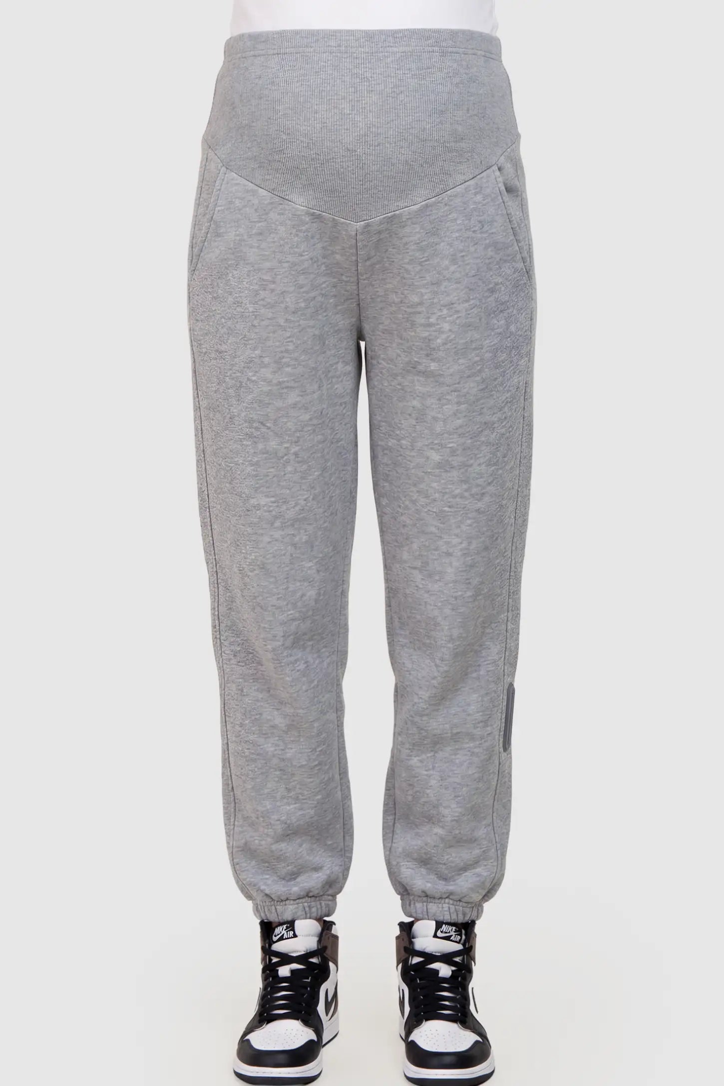 Cotton Blend Full Panel Tapered Leg Maternity Joggers Cotton Blend Full Panel Tapered Leg Maternity Joggers in Gray featuring a high-waisted support band on a pregnant model showing front.