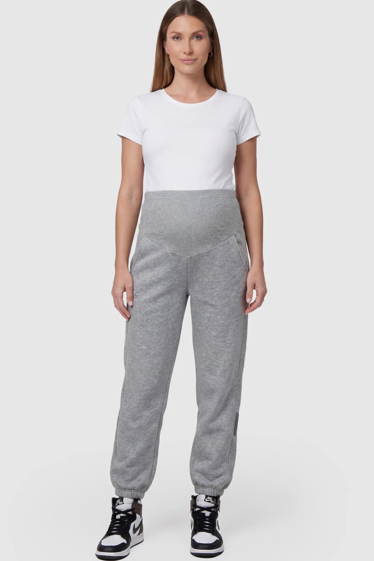 Cotton Blend Full Panel Tapered Leg Maternity Joggers Cotton Blend Full Panel Tapered Leg Maternity Joggers in Gray featuring a high-waisted support band on a pregnant model facing front.