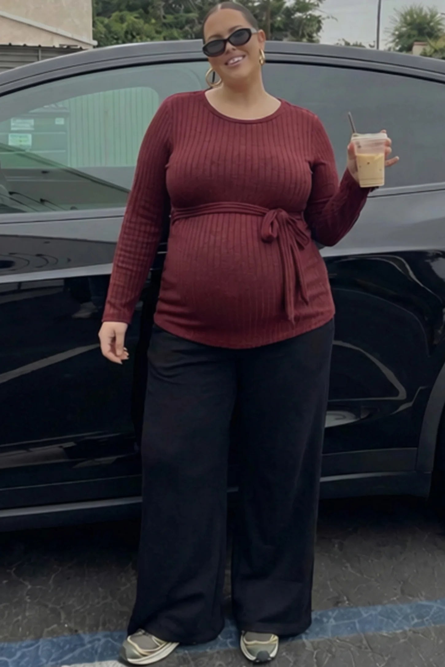 Ribbed Tie-Waist Long Sleeve Maternity Top Ribbed Tie-Waist Long Sleeve Maternity Top in Red featuring an adjustable waist on a pregnant model.