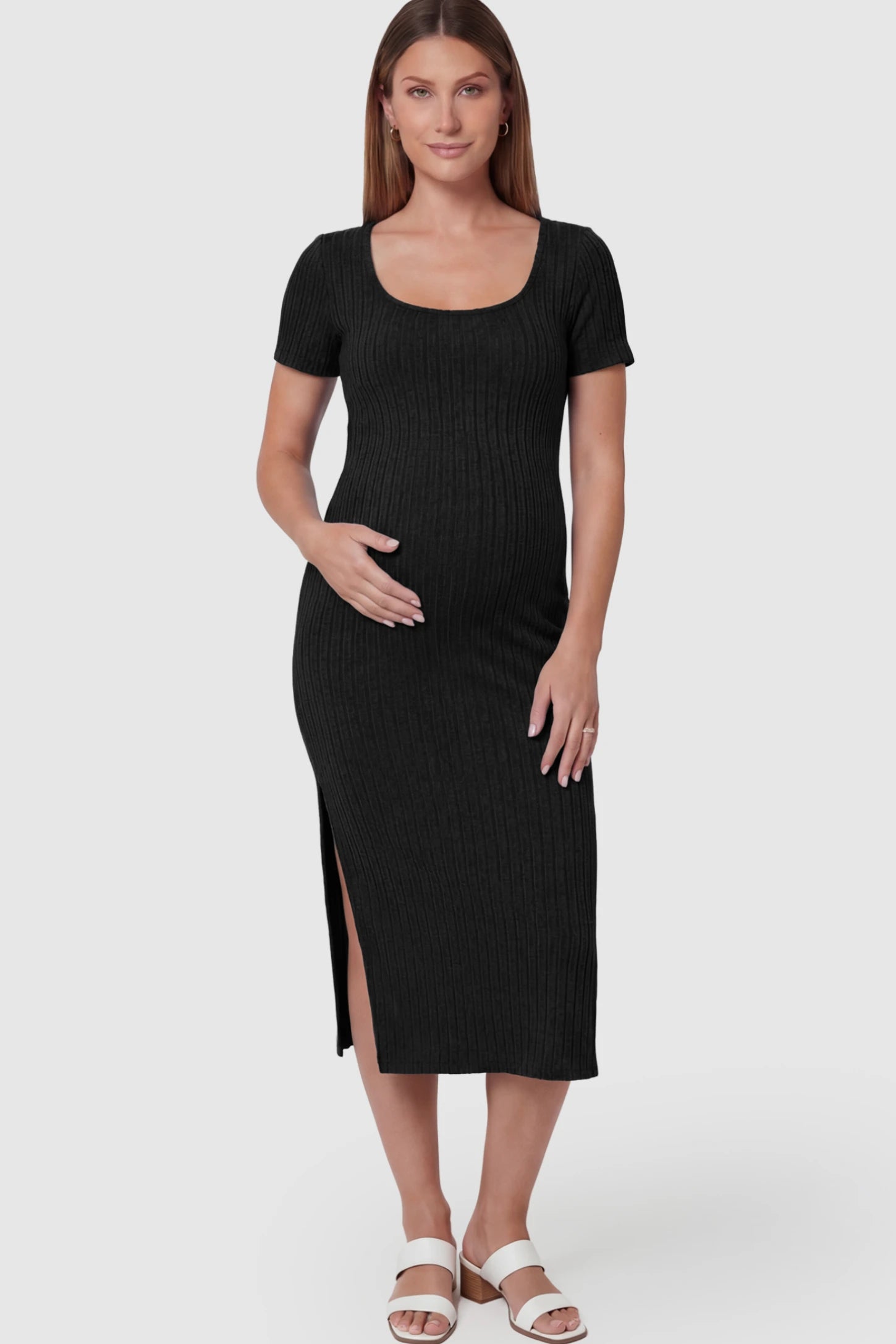 Ribbed Knit Scoop Neck Side Slit Maternity Midi Dress Ribbed Knit Scoop Neck Side Slit Maternity Midi Dress in Black featuring a side slit on a pregnant model.