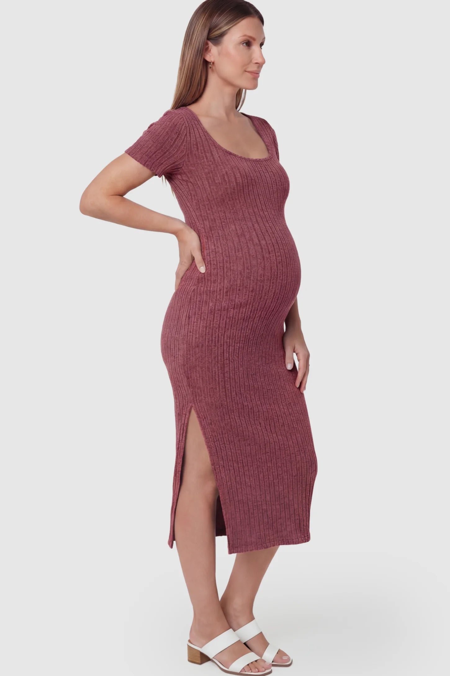 Ribbed Knit Scoop Neck Side Slit Maternity Midi Dress Ribbed Knit Scoop Neck Side Slit Maternity Midi Dress in Wine Red featuring a side slit on a pregnant model.