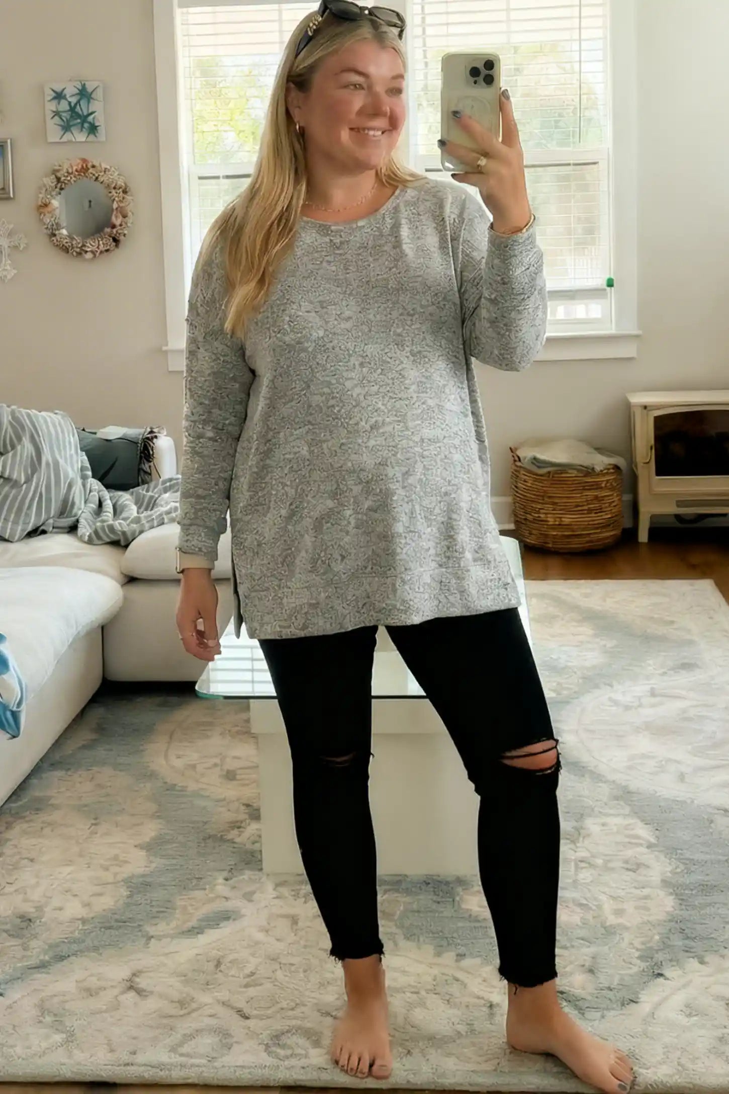 Stretch Panel Distressed Skinny Maternity Jeans Stretch Panel Distressed Skinny Maternity Jeans in Black featuring a high-rise elastic waistband and ripped knees on a pregnant model.