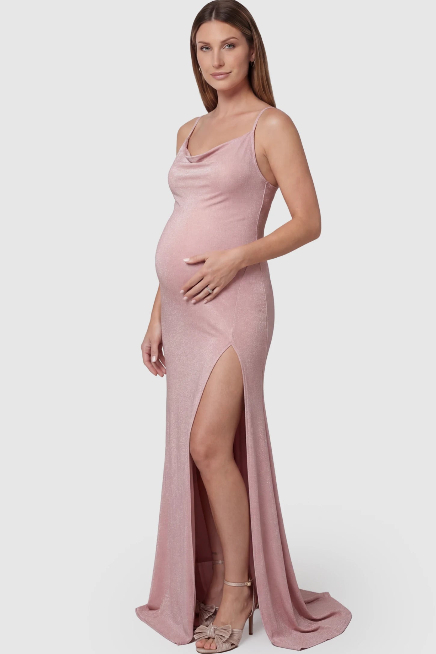 Spaghetti Strap Side Slit Slim Fitting Maternity Maxi Dress in Shimmer Pink featuring a draped neck on a pregnant model.
