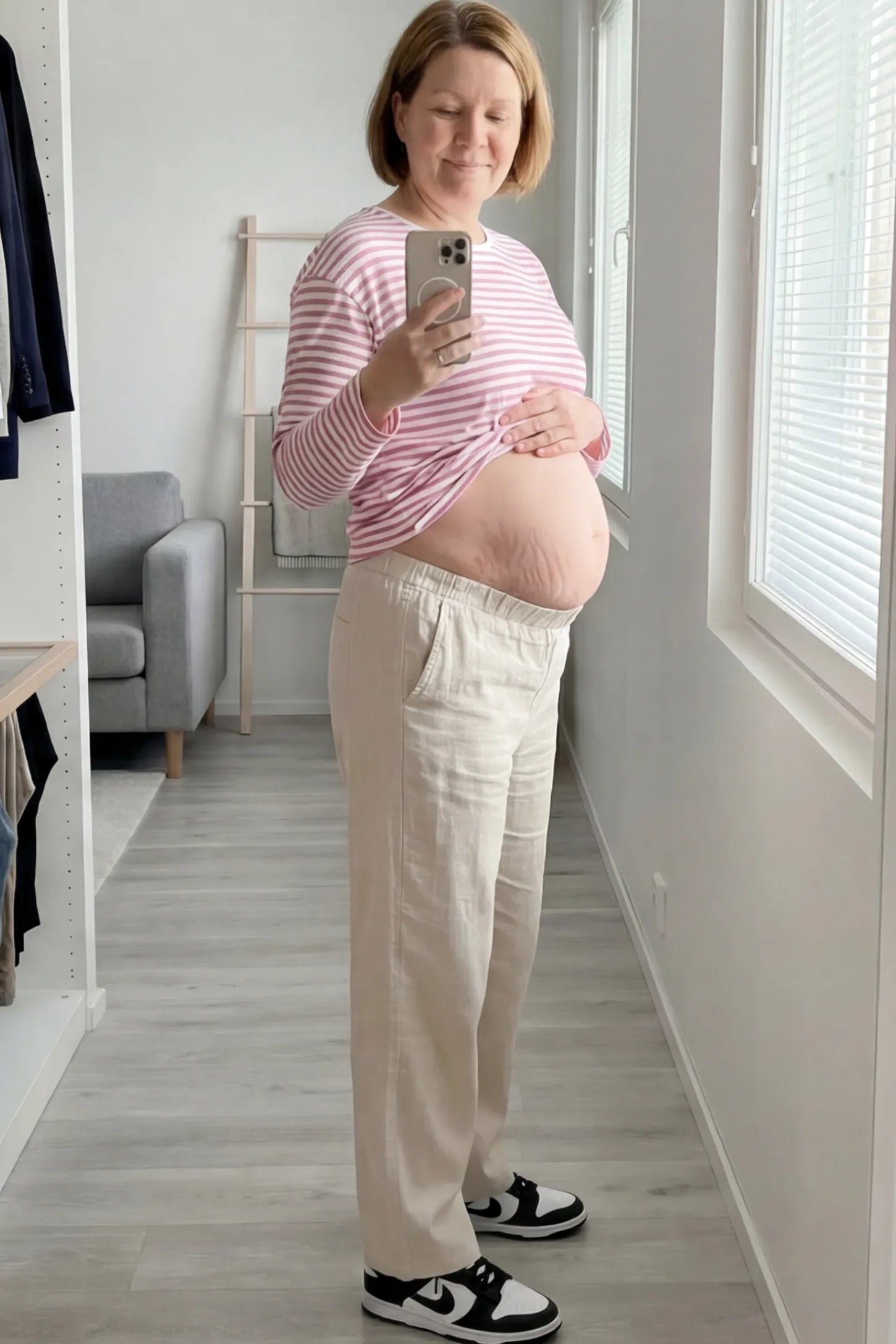 Adjustable Elastic Waist Wide Leg Maternity Pants Adjustable Elastic Waist Wide-Leg Maternity Pants in Beige featuring a customizable button-hole waistband on a pregnant woman.
