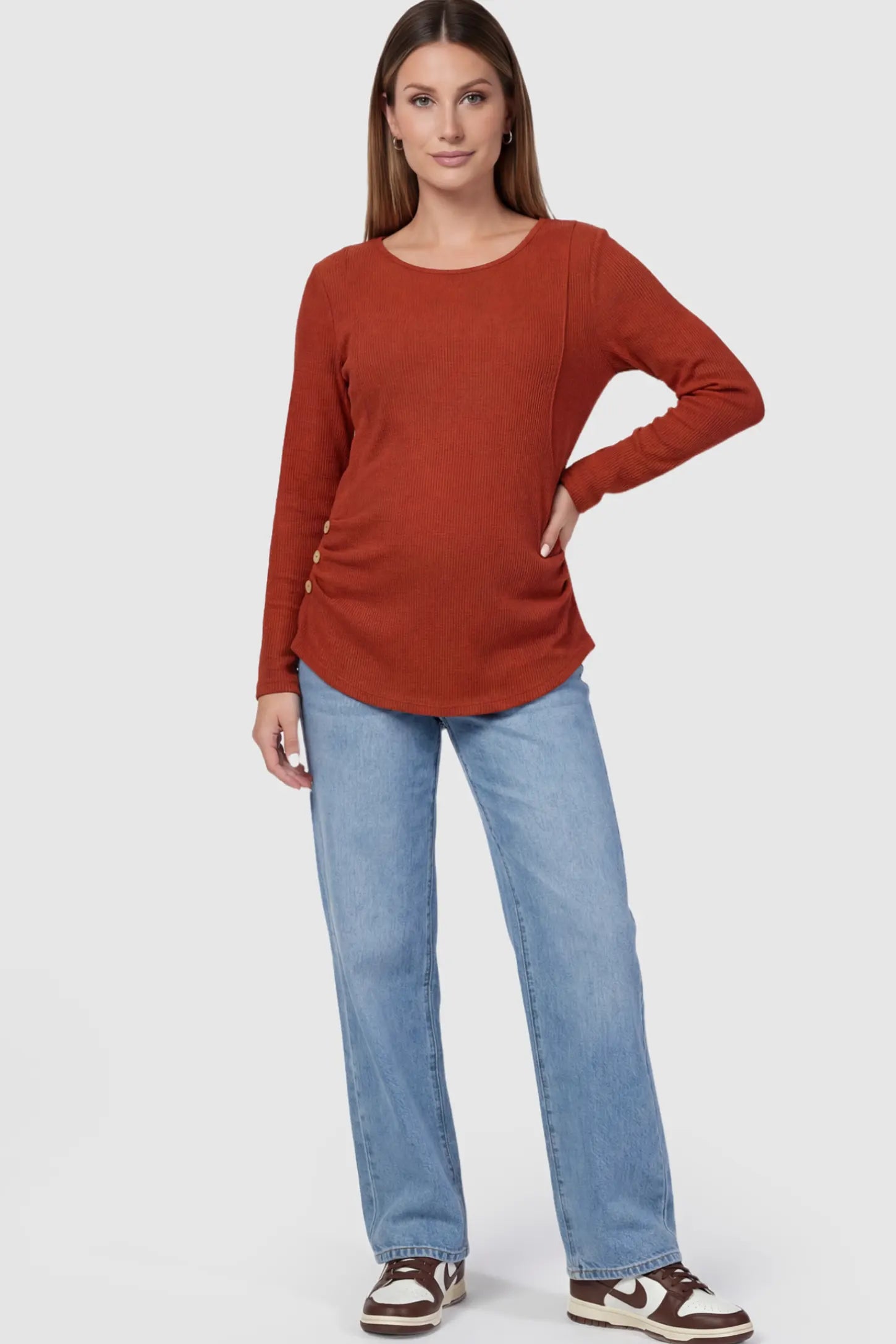 Ribbed Knit Long Sleeve Maternity & Nursing Top Ribbed Knit Long Sleeve Maternity & Nursing Top in Red featuring discreet nursing access on a pregnant model.
