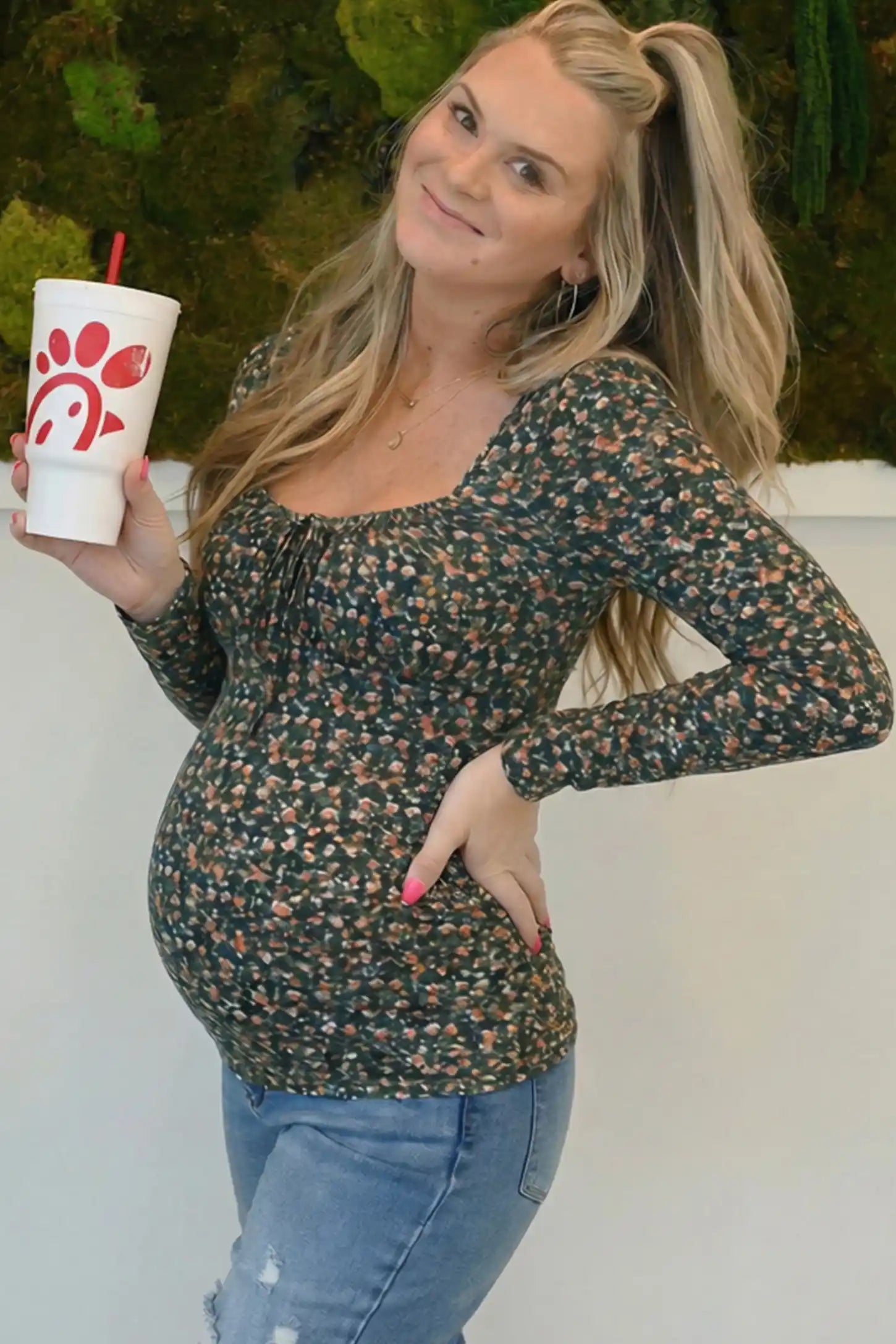 Floral Square Neck Maternity Top Floral Square Neck Maternity Top in floral print featuring a smocked bodice on a pregnant model in a social proof image.