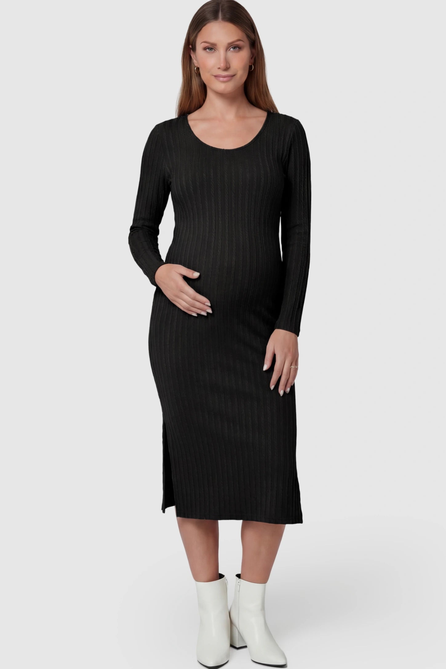 Ribbed Knit Long Sleeve Bodycon Maternity Midi Dress Ribbed Knit Long Sleeve Bodycon Maternity Midi Dress in Black featuring a Side Slit on a pregnant model.
