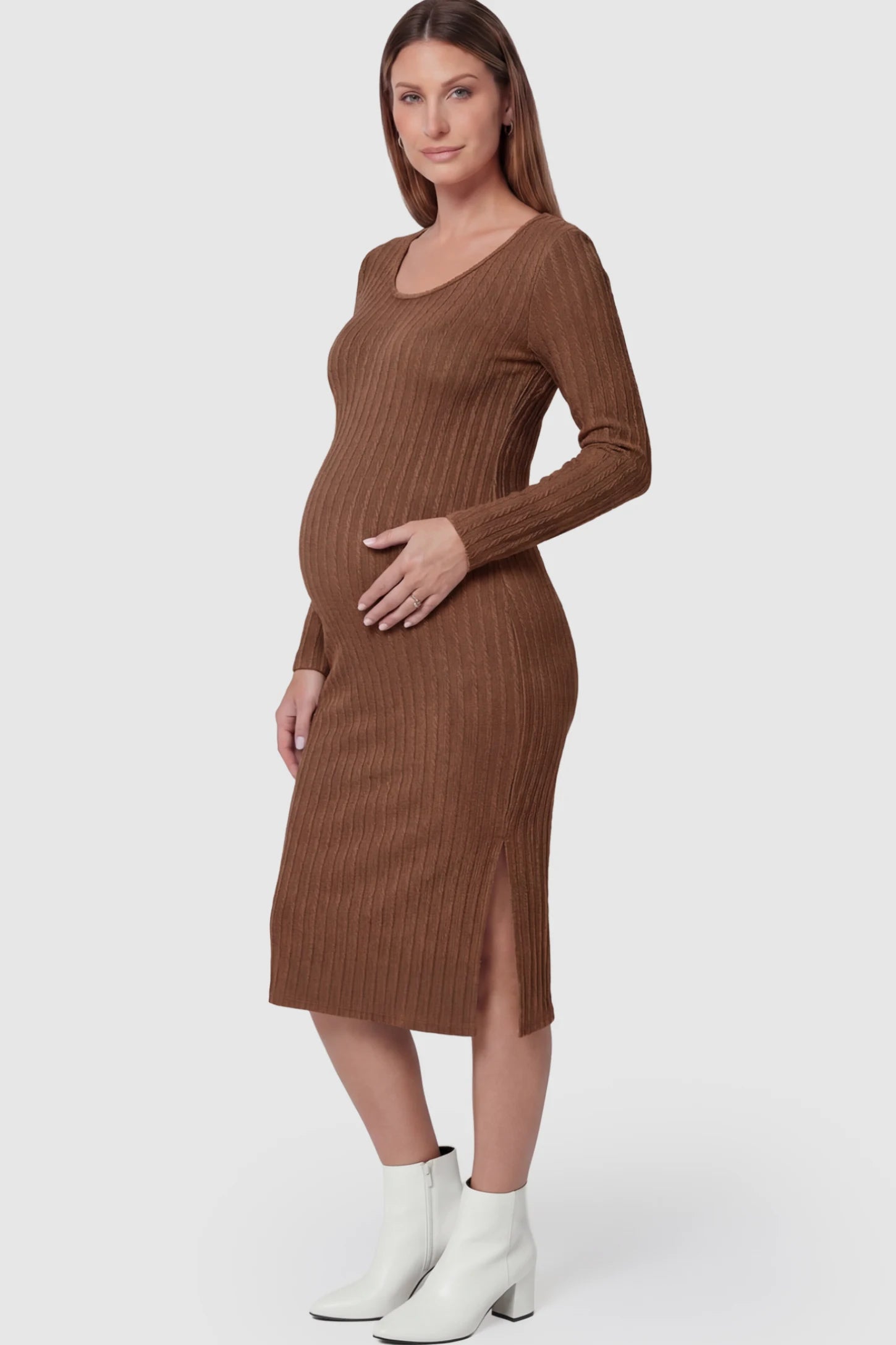 Ribbed Knit Long Sleeve Bodycon Maternity Midi Dress Ribbed Knit Long Sleeve Bodycon Maternity Midi Dress in Brown featuring a Side Slit on a pregnant model.