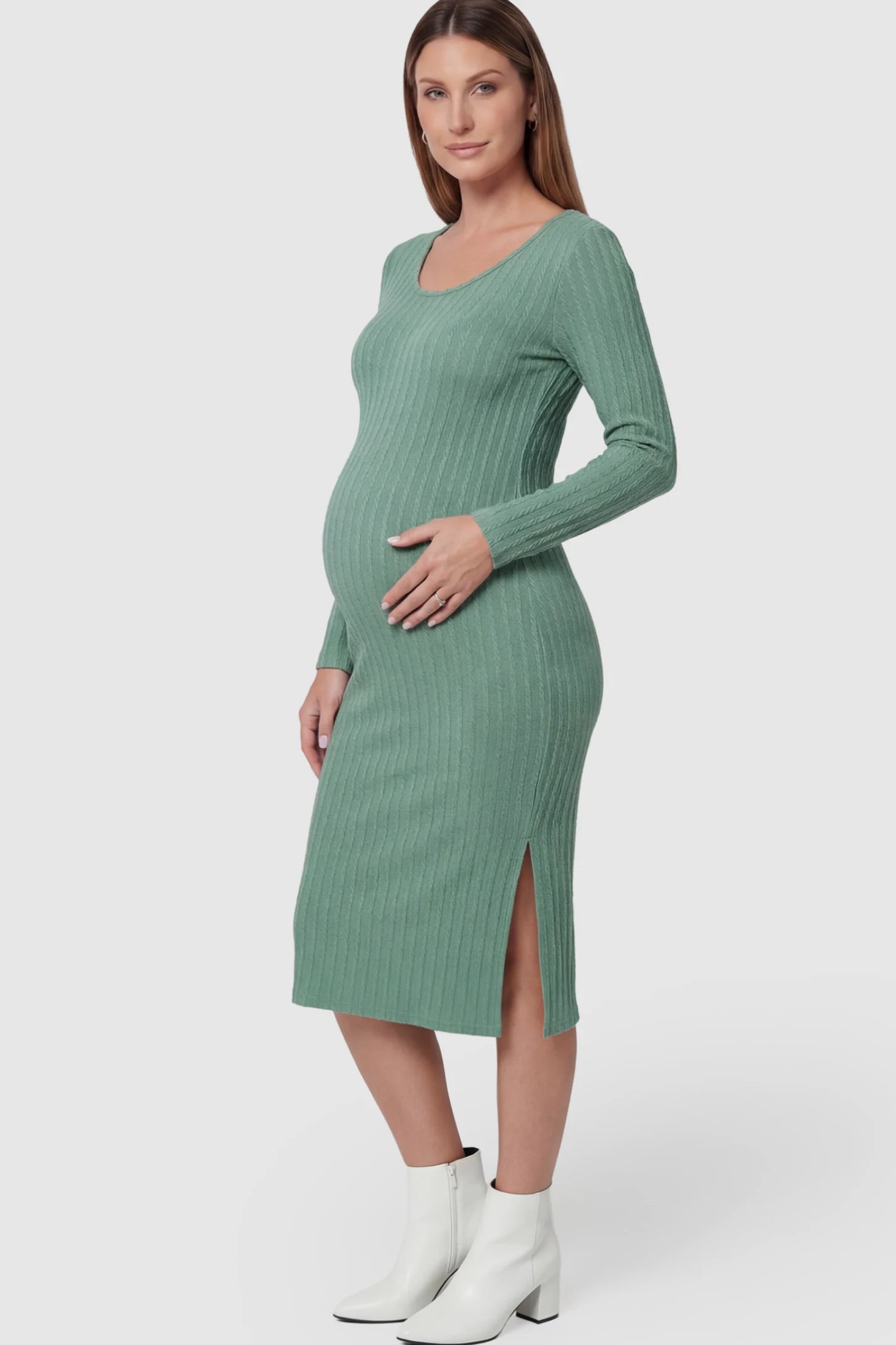 Ribbed Knit Long Sleeve Bodycon Maternity Midi Dress in Green featuring a Side Slit on a pregnant model.
