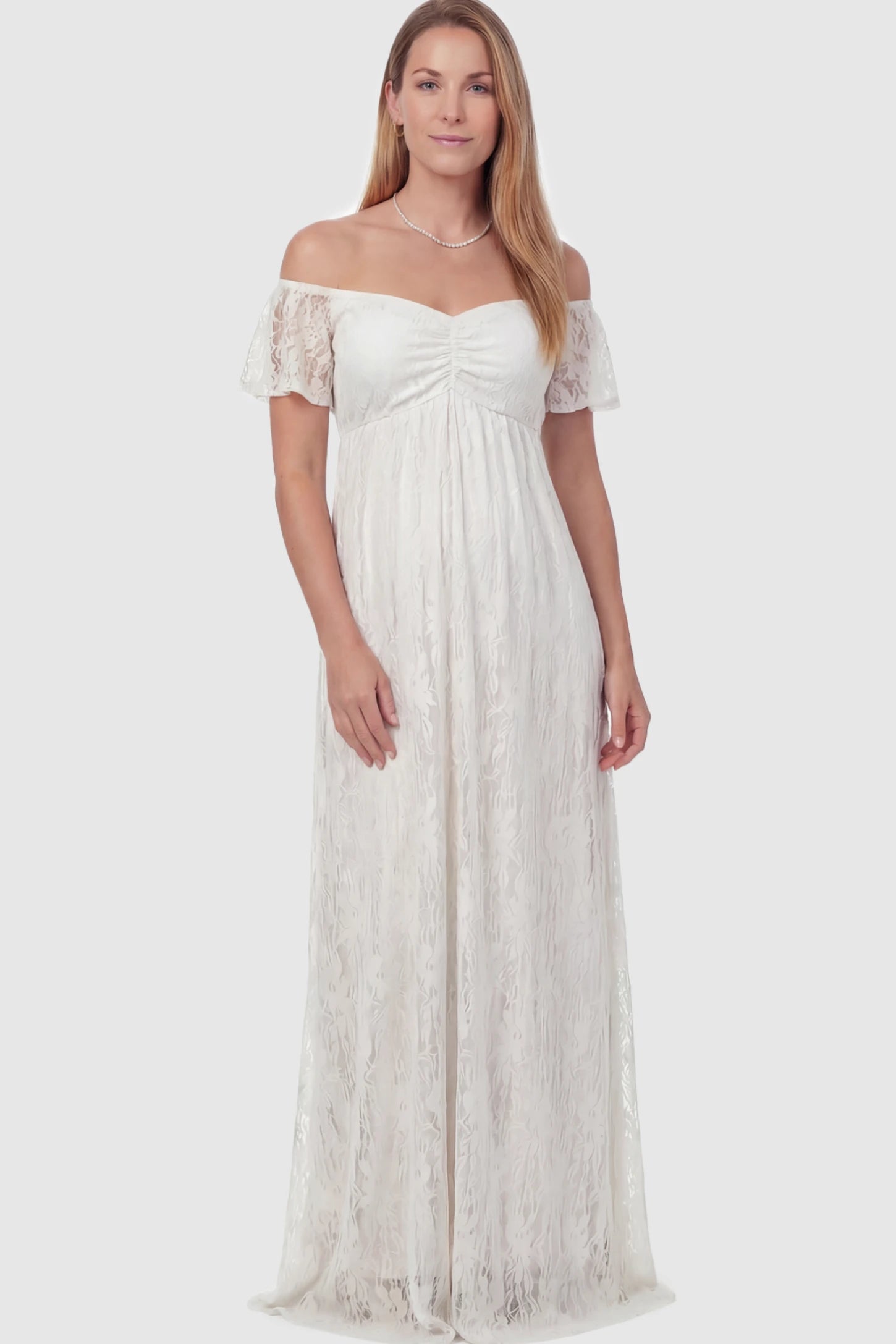 Floral Lace Off Shoulder Maternity Maxi Dress Floral Lace Off The Shoulder Maternity Maxi Dress featuring a ruched bust in White on a postpartum model.