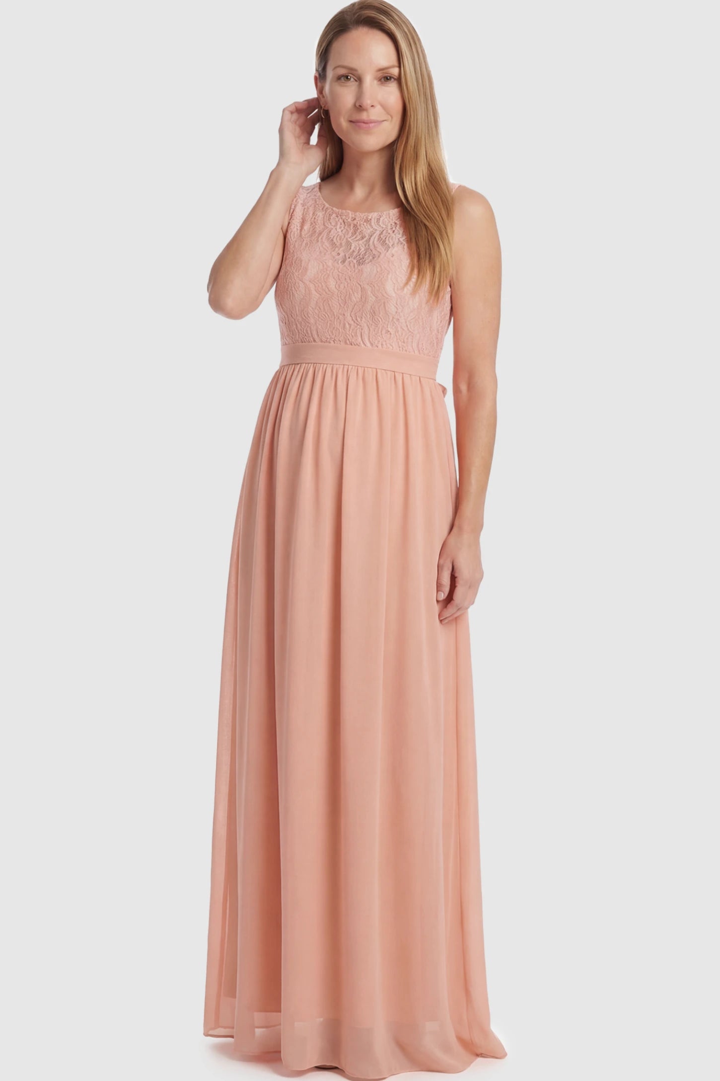 Floral Lace Sleeveless Maternity Maxi Dress Floral Lace Sleeveless Maternity Maxi Dress in Pink featuring a flowing skirt on a postpartum model.