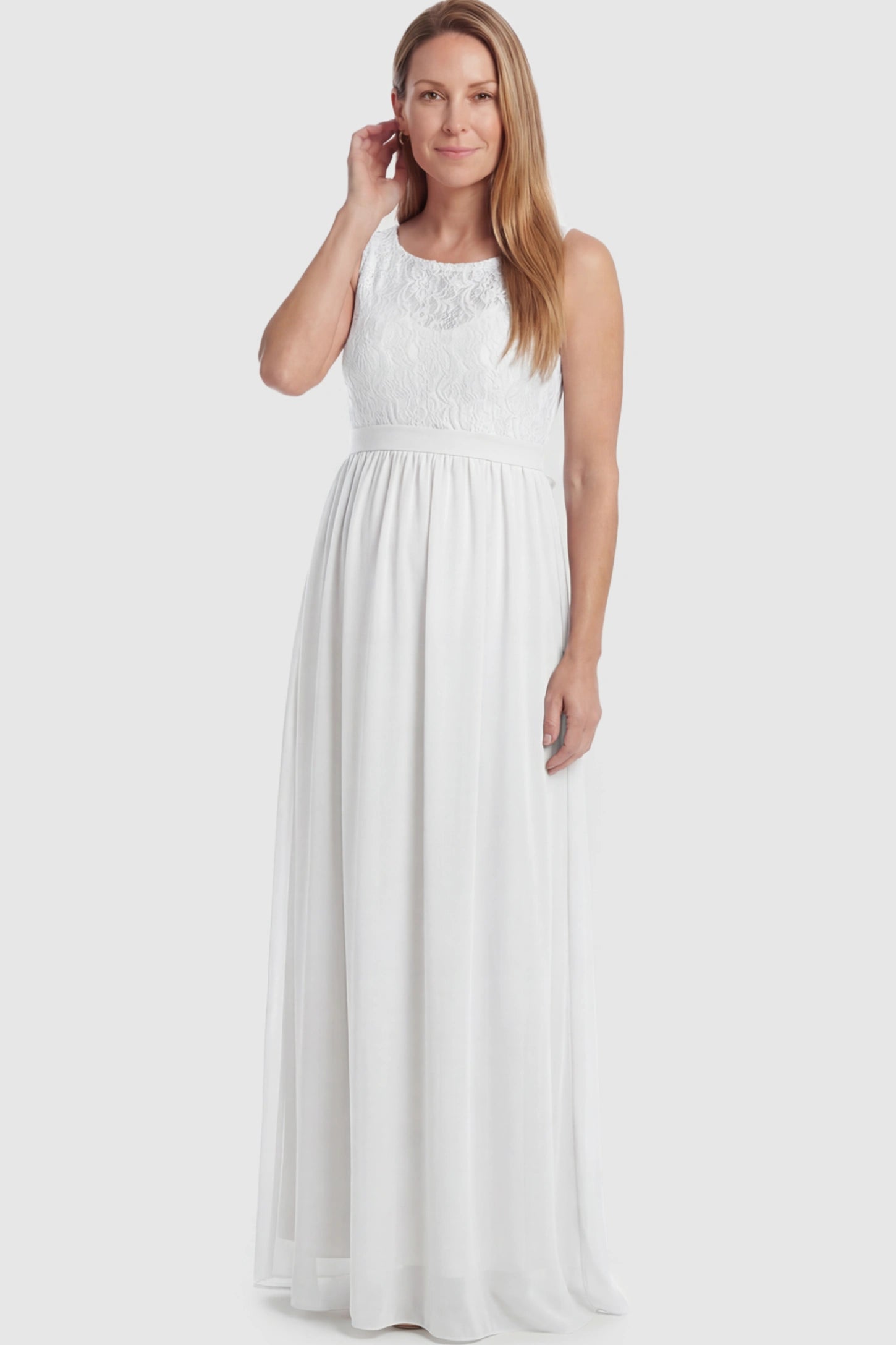 Floral Lace Sleeveless Maternity Maxi Dress Floral Lace Sleeveless Maternity Maxi Dress in White featuring a flowing skirt on a postpartum model.
