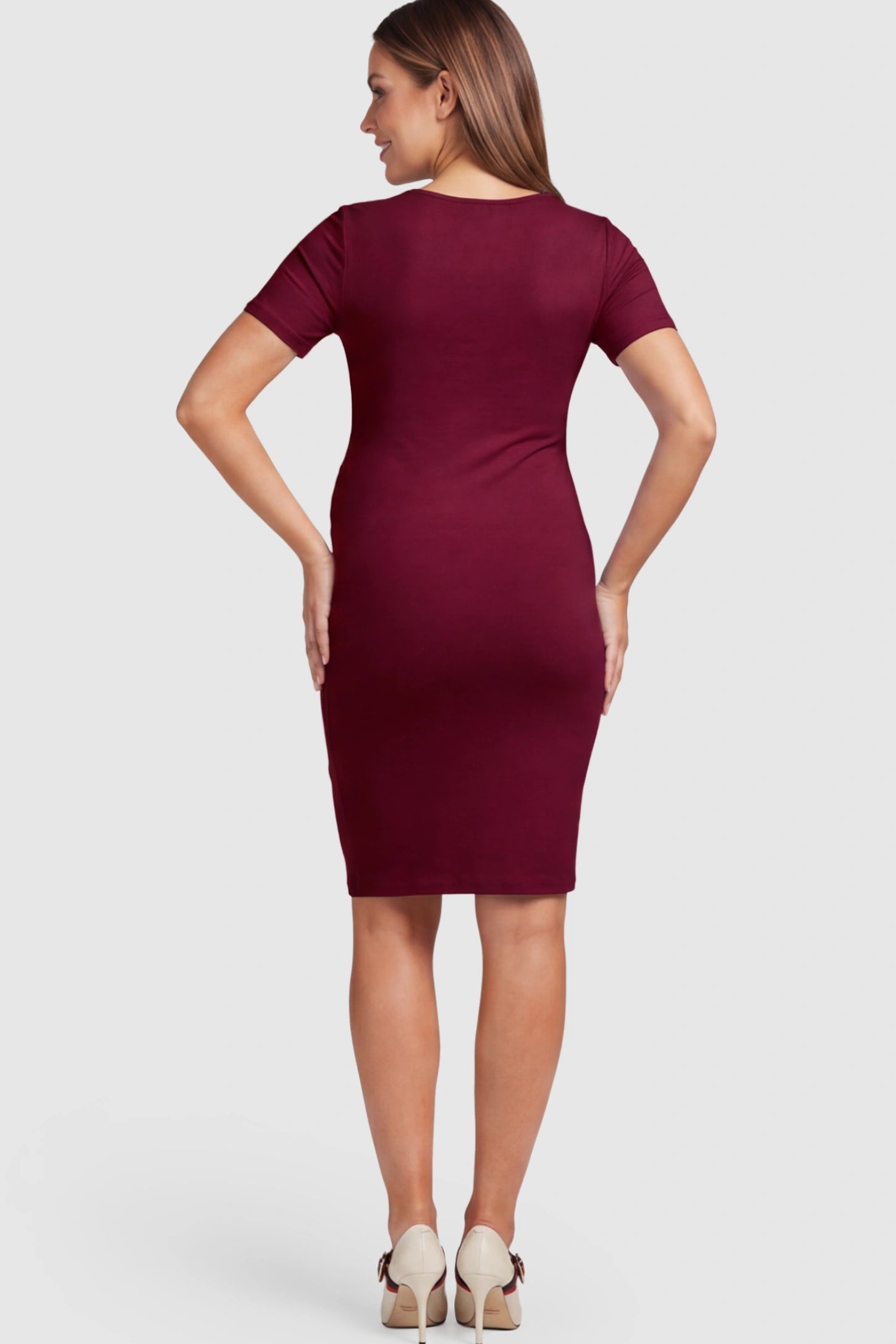 Ruched Side Scoop Neck Maternity Short Dress Ruched Side Scoop Neck Maternity Short Dress in Burgundy featuring a form-fitting silhouette on a pregnant model.