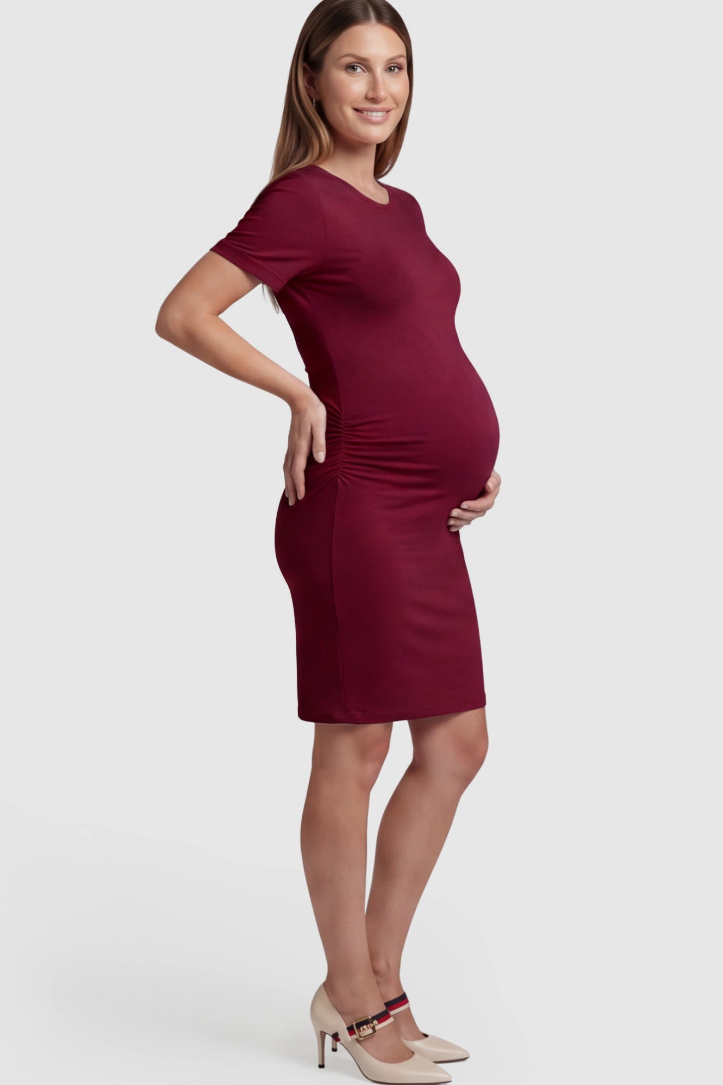 Ruched Side Scoop Neck Maternity Short Dress in Burgundy featuring a form-fitting silhouette on a pregnant model.