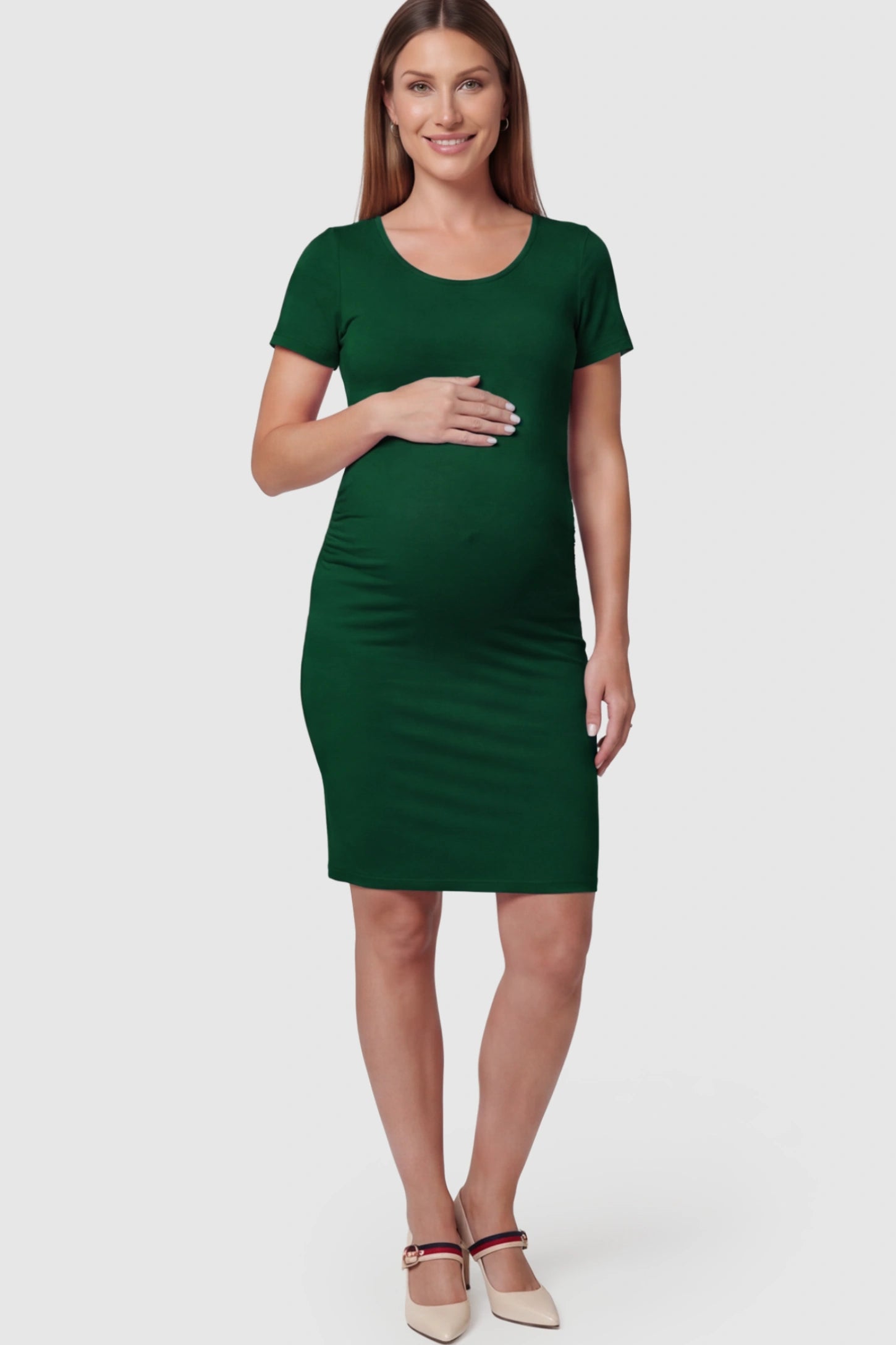Ruched Side Scoop Neck Maternity Short Dress Ruched Side Scoop Neck Maternity Short Dress in Green featuring a form-fitting silhouette on a pregnant model.