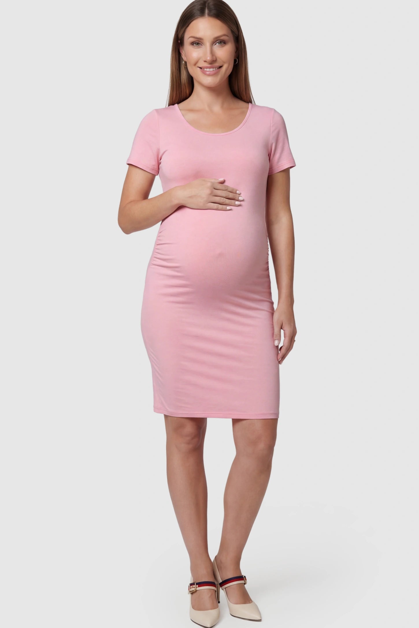 Ruched Side Scoop Neck Maternity Short Dress Ruched Side Scoop Neck Maternity Short Dress in Pink featuring a form-fitting silhouette on a pregnant model.