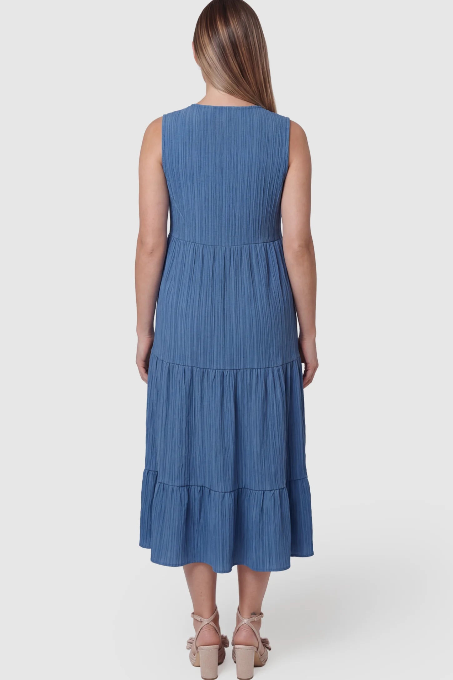 Solid Textured V-Neck Tiered Maternity Midi Dress Solid Textured V-Neck Tiered Maternity Midi Dress in Blue on a pregnant model.