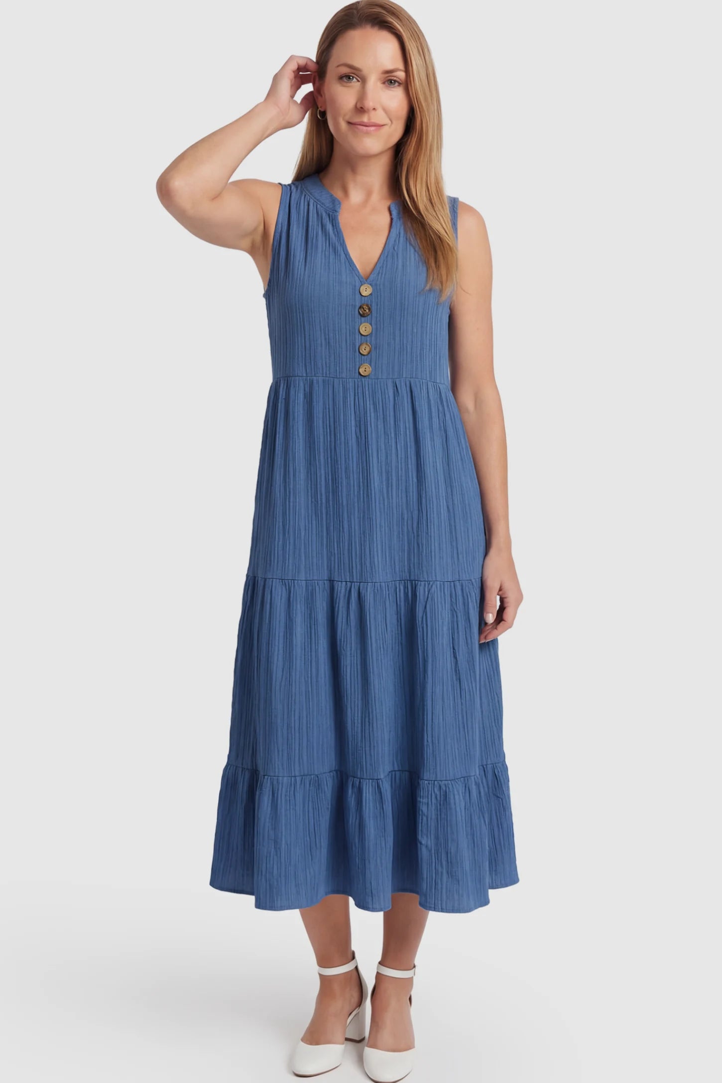 Solid Textured V-Neck Tiered Maternity Midi Dress Solid Textured V-Neck Tiered Maternity Midi Dress in Blue featuring a high-waisted A-line silhouette on a postpartum model.
