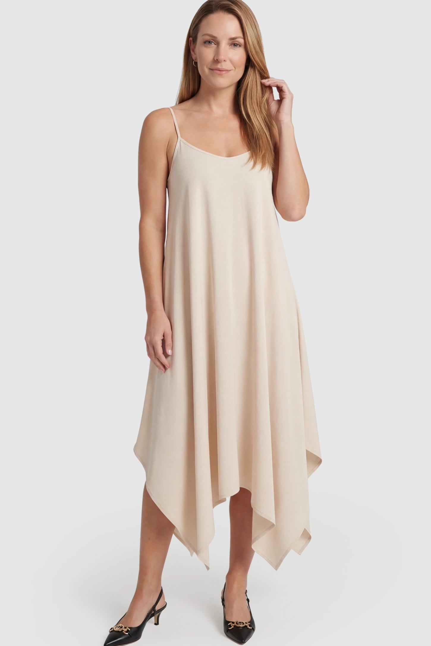 Spaghetti Strap Handkerchief Hem Maternity Midi Dress Spaghetti Strap Handkerchief Hem Maternity Midi Dress in Apricot featuring a scoop-neck on a postpartum model.