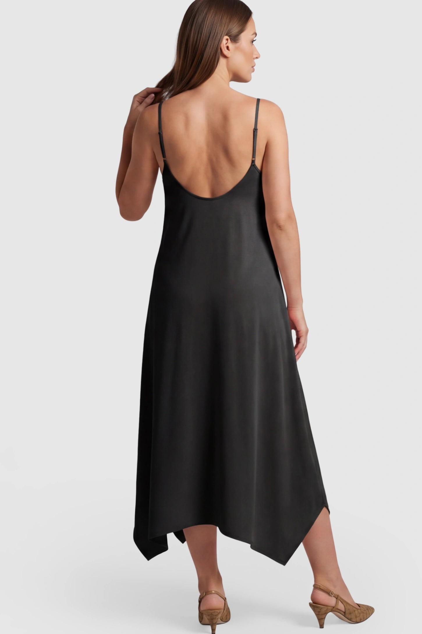 Spaghetti Strap Handkerchief Hem Maternity Midi Dress Spaghetti Strap Handkerchief Hem Maternity Midi Dress in Black on a pregnant model.