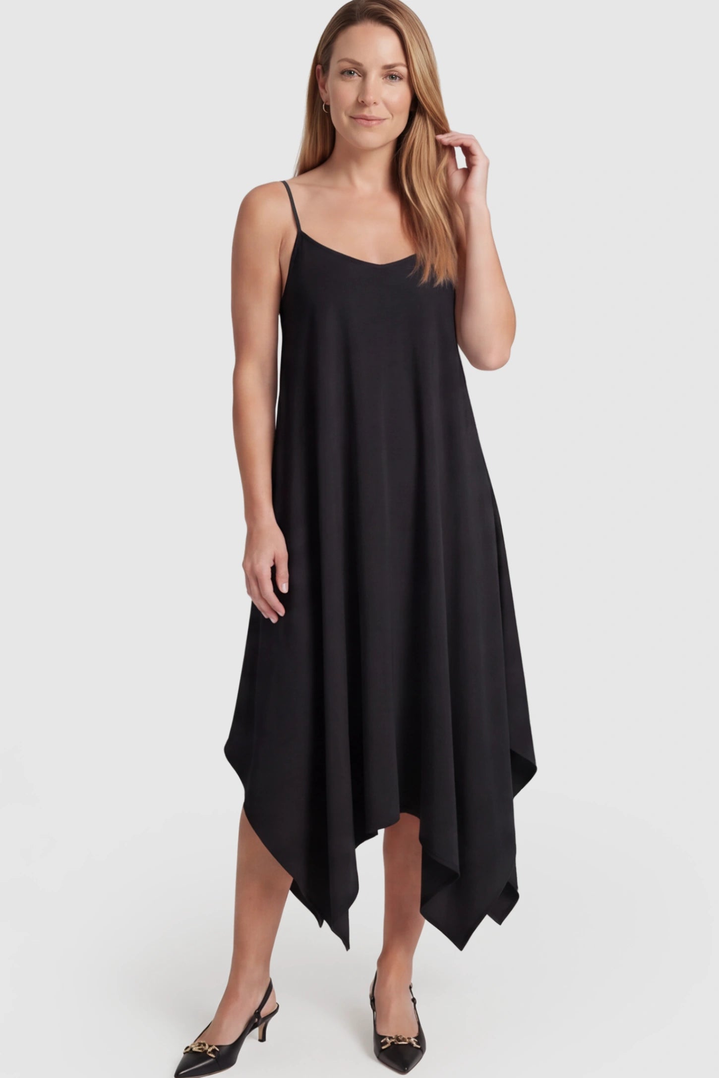 Spaghetti Strap Handkerchief Hem Maternity Midi Dress Spaghetti Strap Handkerchief Hem Maternity Midi Dress in Black featuring a scoop-neck on a postpartum model.