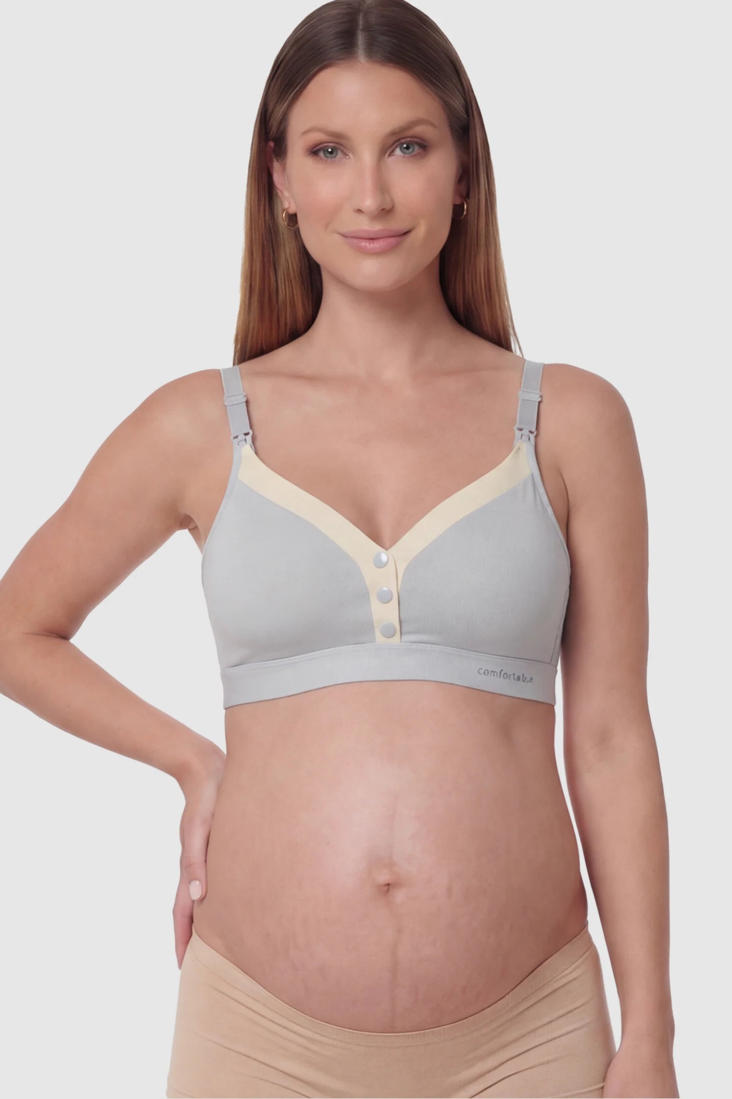 Soft Cotton Front Button Wireless Maternity Nursing Bra Soft Cotton Front-Button Wireless Maternity & Nursing Bra in Blue featuring snap-front access on a pregnant model.