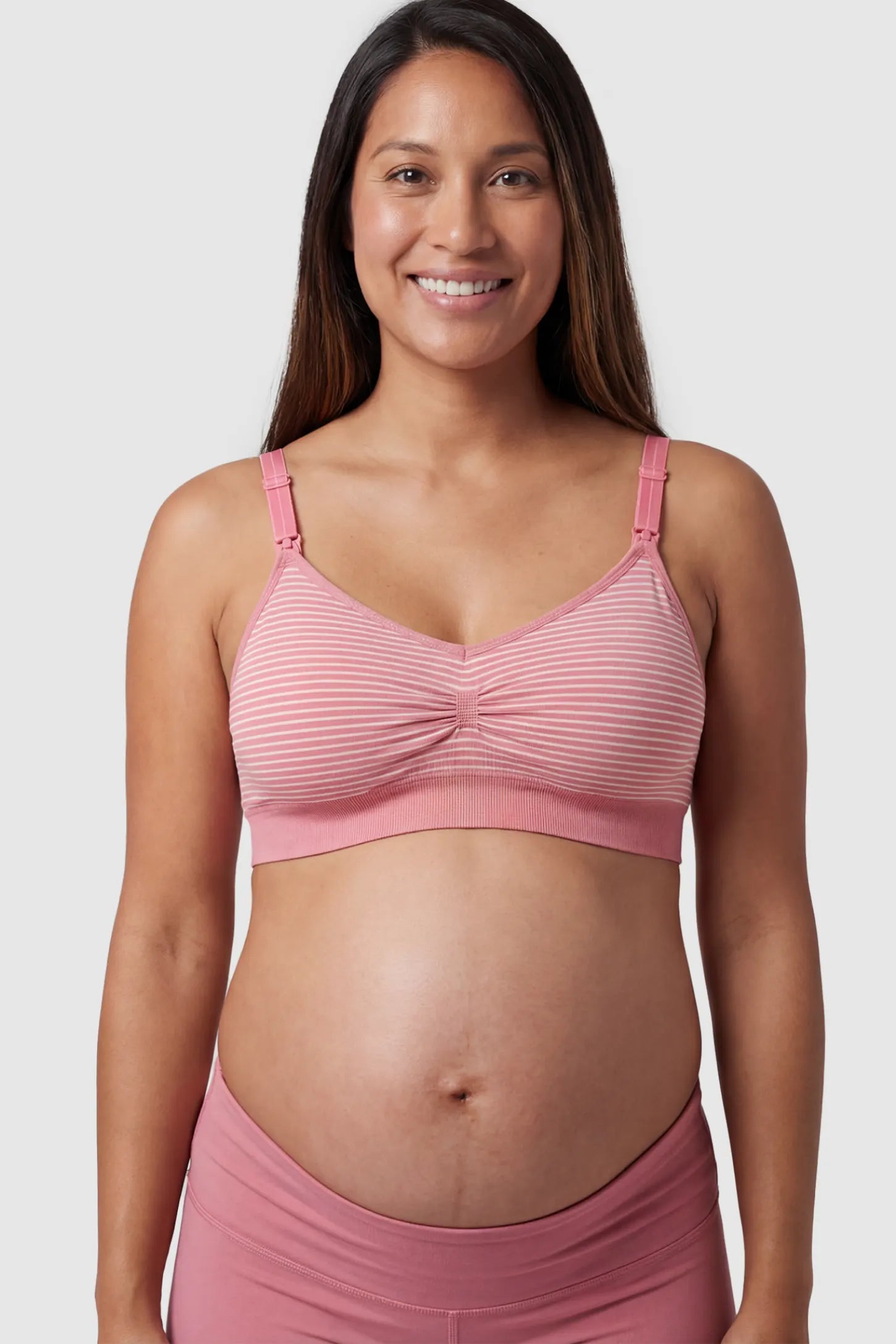 Striped Seamless Clip-Down Nursing Bra in pink featuring a ruched center and nursing clips on a pregnant model.