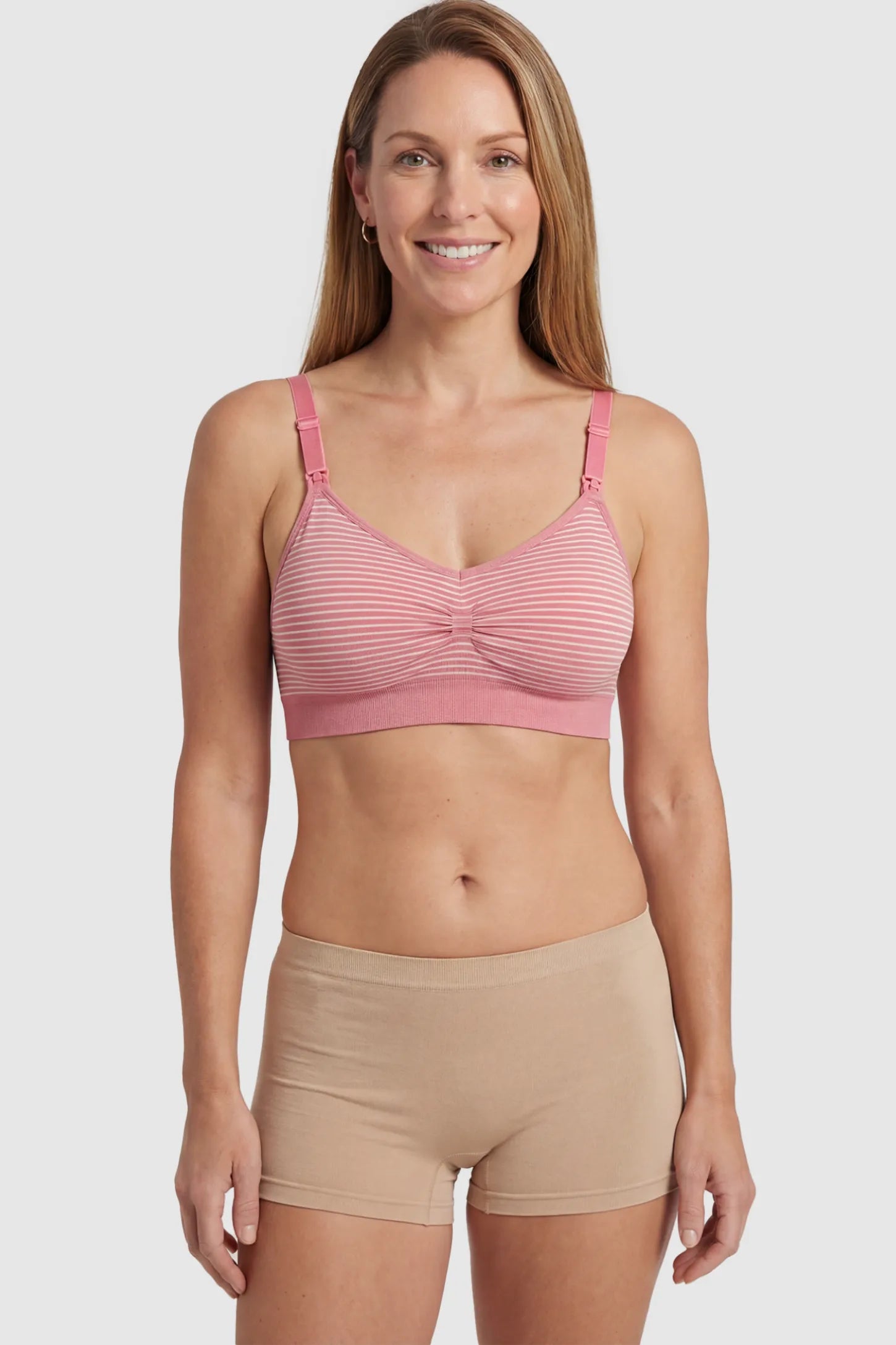 Striped Seamless Clip Down Maternity Nursing Bra Striped Seamless Clip-Down Nursing Bra in pink featuring a ruched center and nursing clips on a postpartum model.