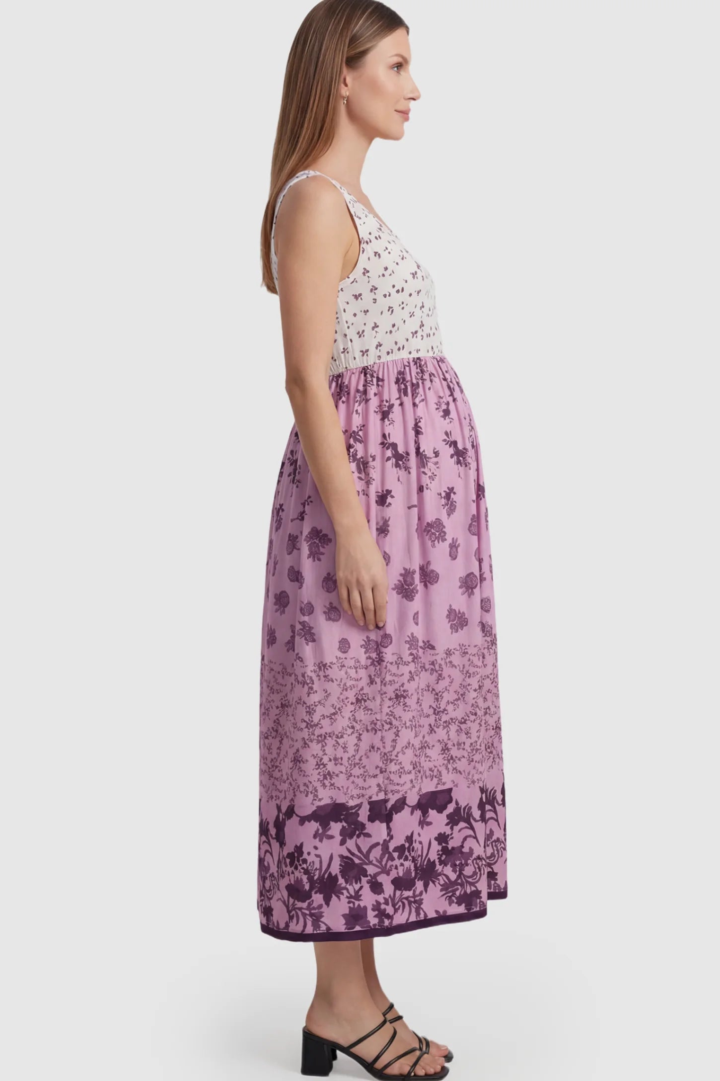 Floral Print Scoop Neck Maternity Midi Dress in pink floral featuring a high empire waist on a pregnant model.