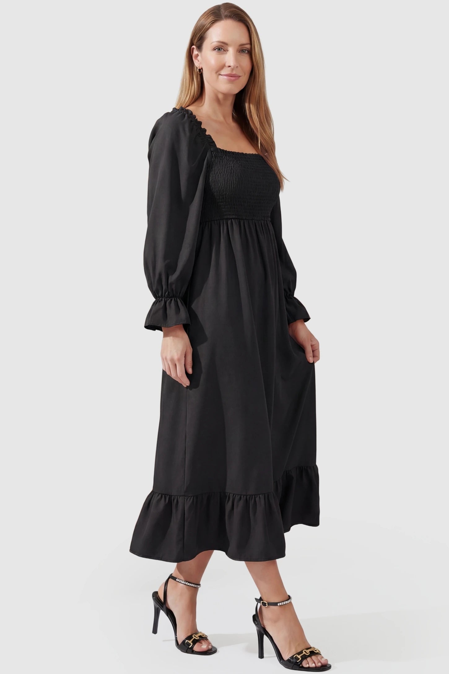 Solid Color Square Neck Ruffle Hem Midi Maternity Dress Black Square Neck Ruffle Hem Midi Maternity Dress featuring a flexible smocked bodice on a non-pregnant model in a front view.