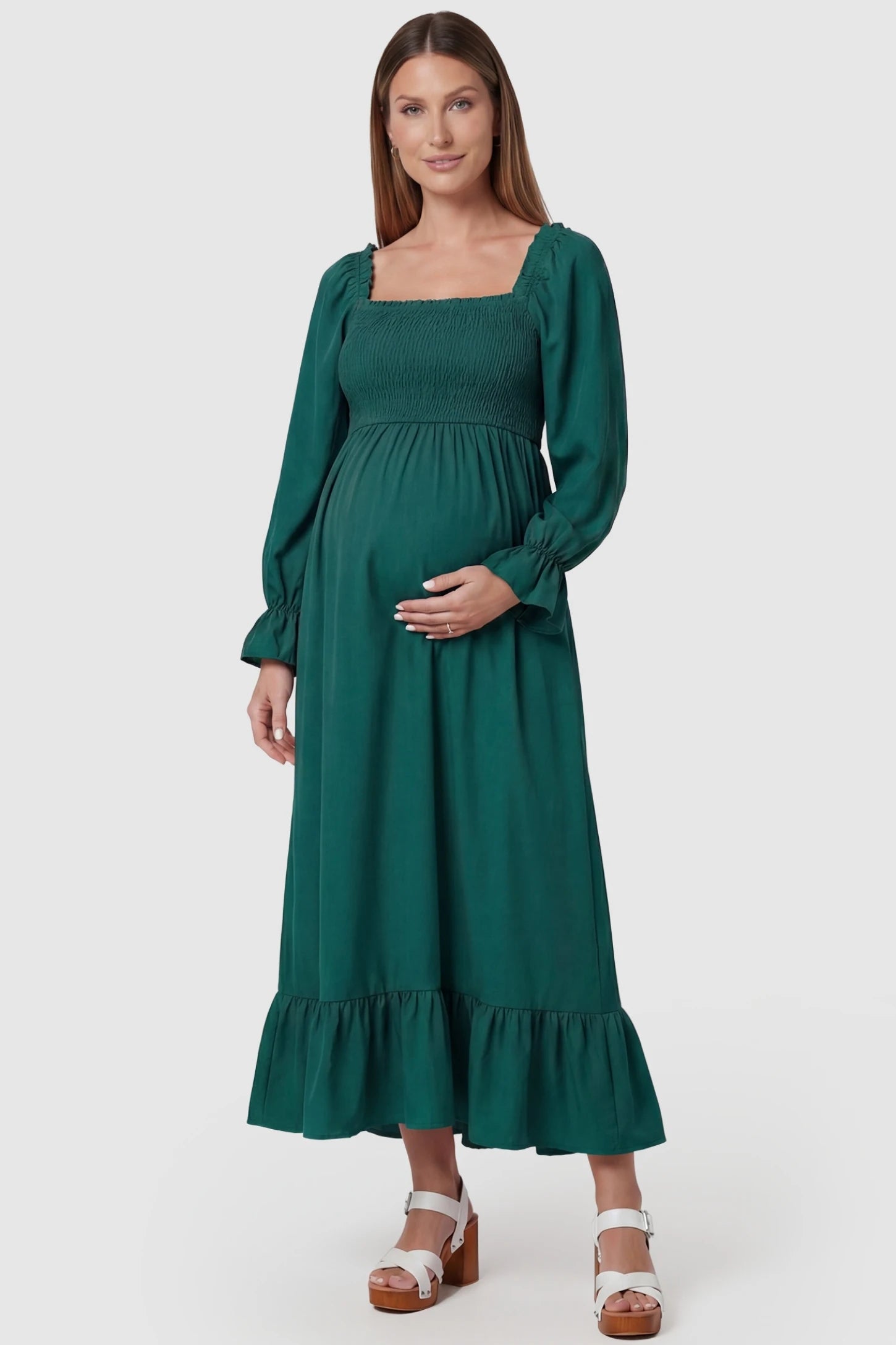 Solid Color Square Neck Ruffle Hem Midi Maternity Dress Green Square Neck Ruffle Hem Midi Maternity Dress featuring a smocked bodice and A-line swing on a pregnant model, front view.