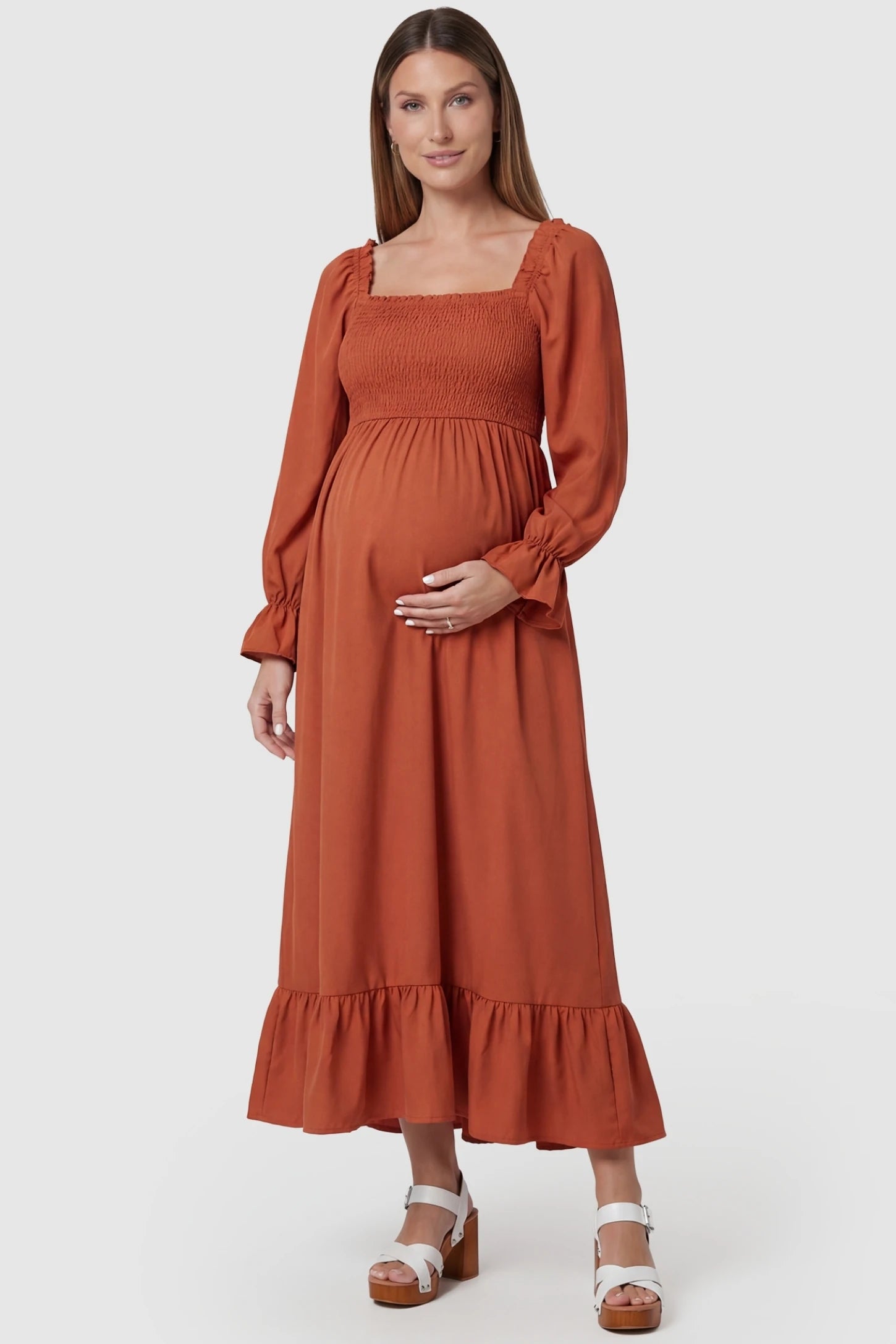 Solid Color Square Neck Ruffle Hem Midi Maternity Dress Orange Square Neck Ruffle Hem Midi Maternity Dress featuring a high-waist A-line silhouette on a pregnant model, front view.