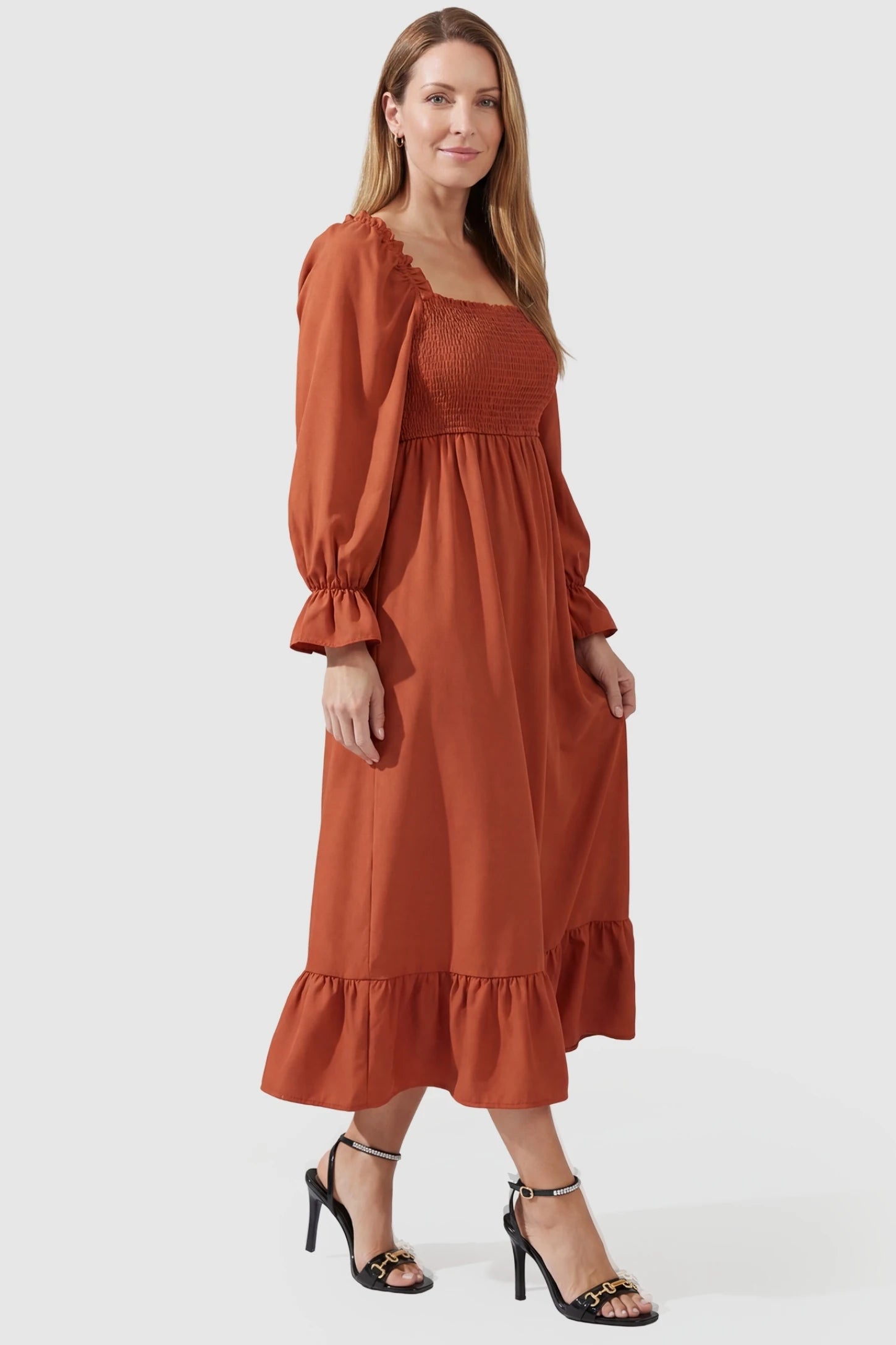 Solid Color Square Neck Ruffle Hem Midi Maternity Dress Orange Square Neck Ruffle Hem Midi Maternity Dress featuring a flexible smocked bodice on a non-pregnant model, side view.