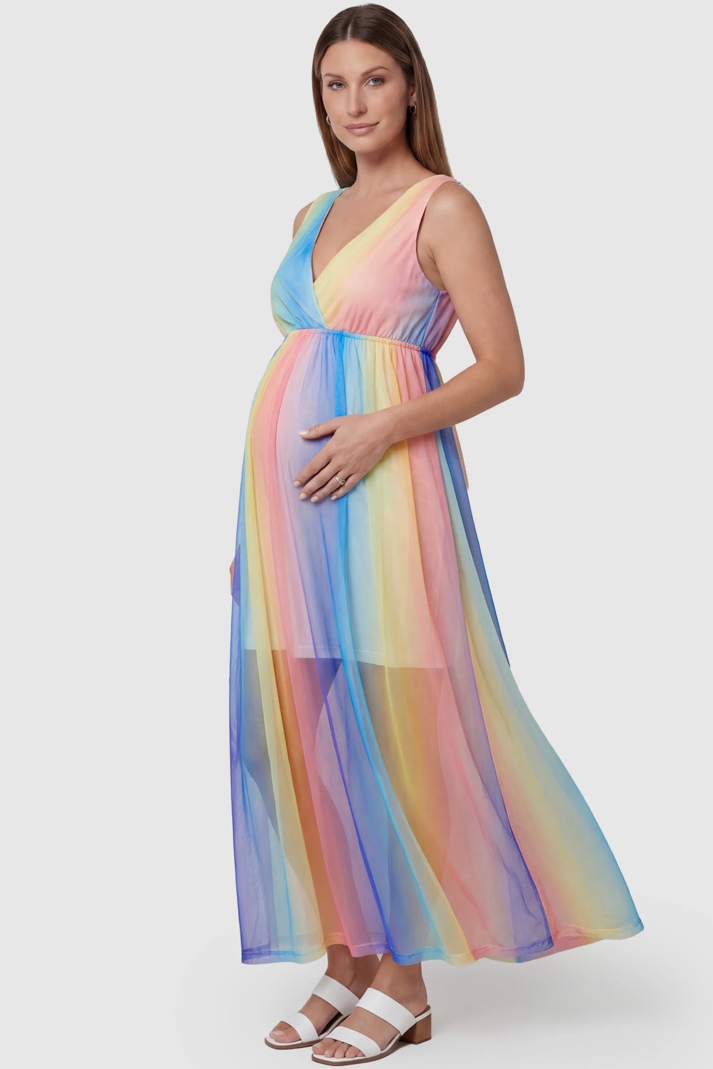 Rainbow Gradient Surplice Neck Maxi Maternity Dress featuring a stretchy empire waist on a pregnant model, side view.
