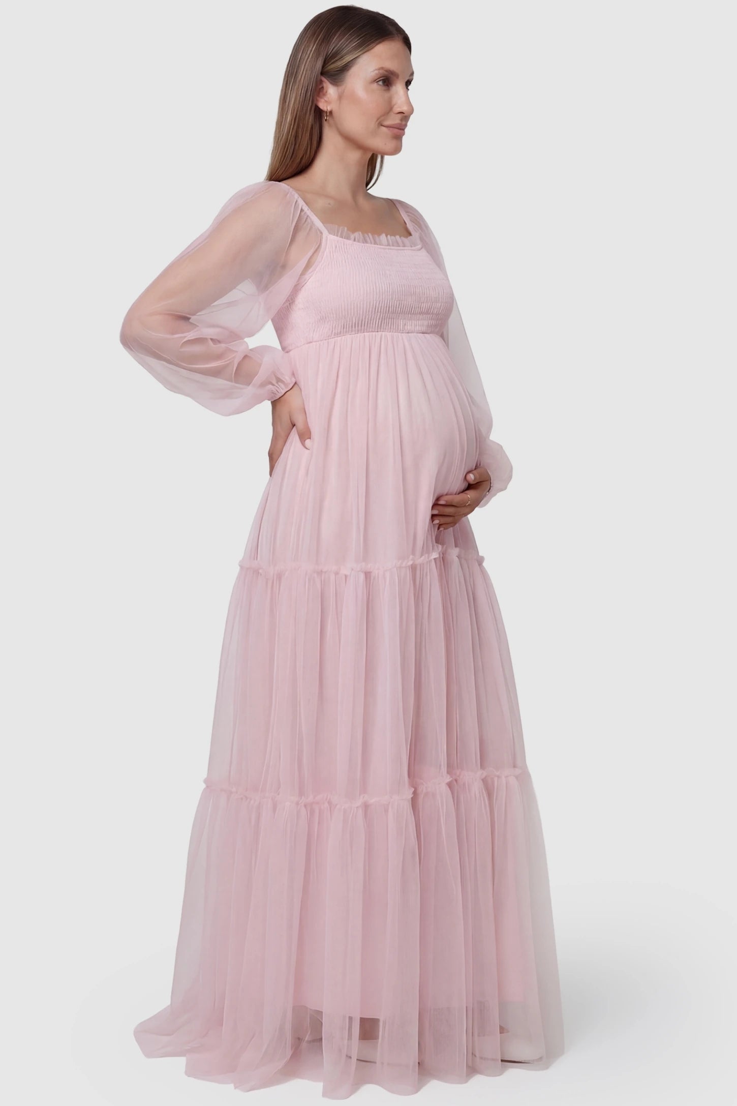 Tulle Lantern Sleeve Tiered Maternity Photoshoot Gown in Pink featuring a sheer lantern sleeve and side view on a pregnant model.