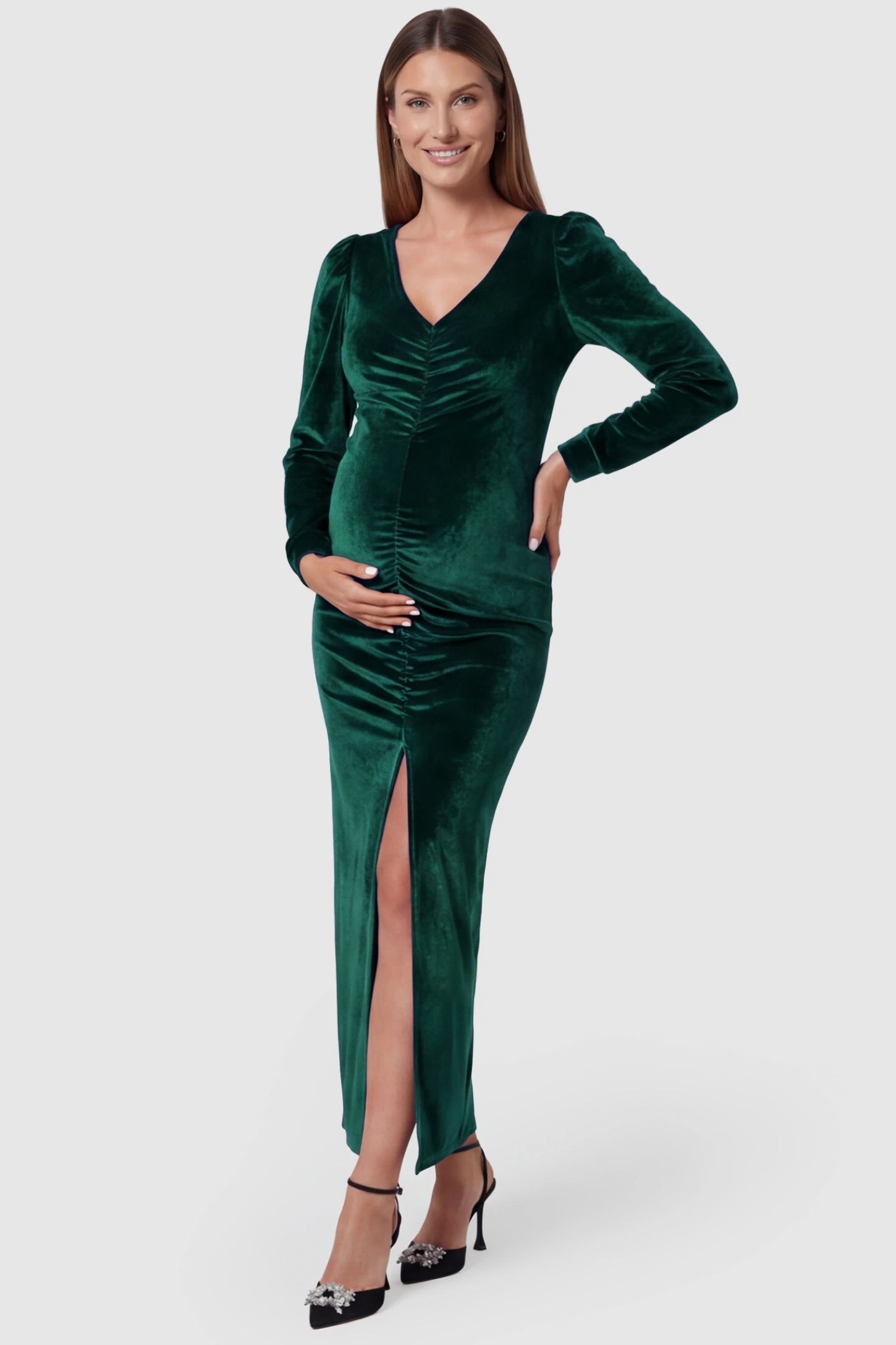 High Slit Velvet Pencil Cut Maternity Evening Dress High Slit Velvet Pencil Cut Maternity Evening Dress in Green featuring a plunging V-neck on a pregnant model, front view.