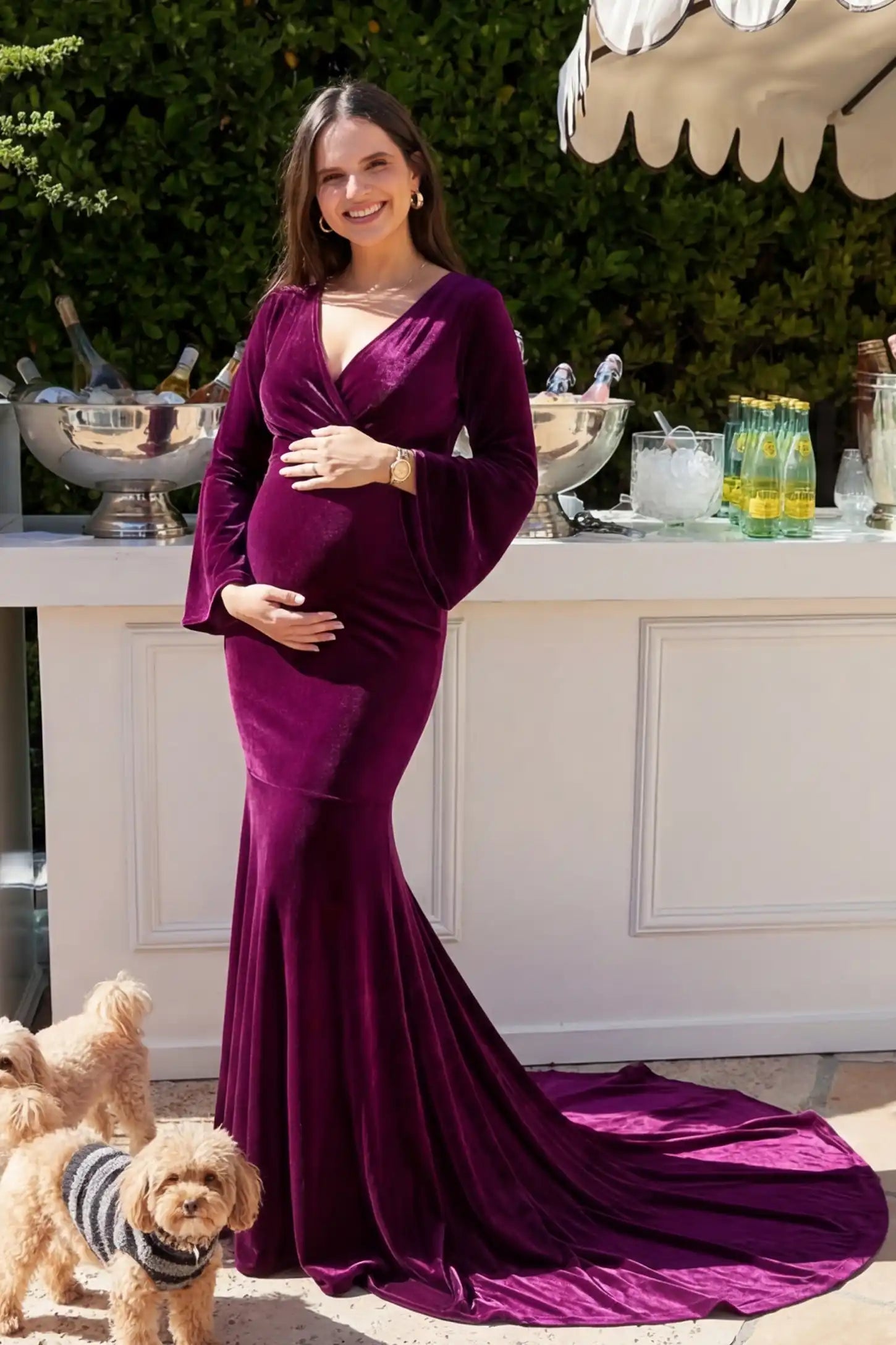 Velvet Long Bell Sleeve Maternity Mermaid Gown Front of Velvet Long Bell Sleeve Maternity Mermaid Gown in Burgundy featuring elegant bell sleeves on a pregnant model.
