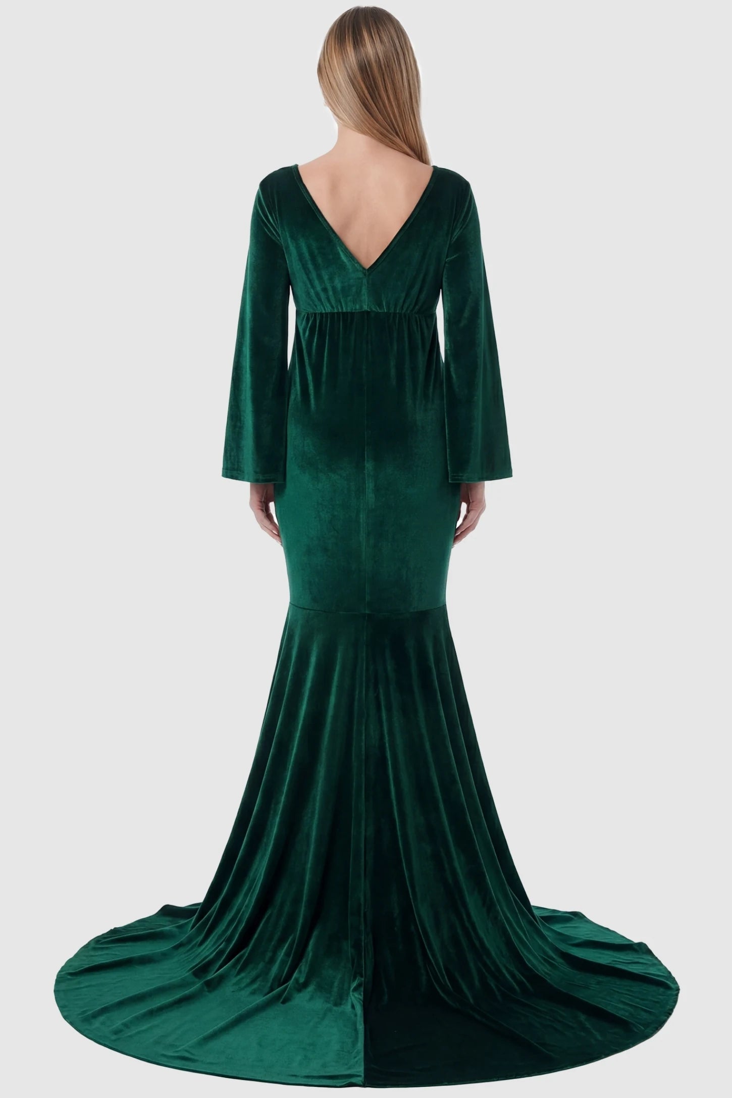 Velvet Long Bell Sleeve Maternity Mermaid Gown Velvet Long Bell Sleeve Maternity Mermaid Gown in Green featuring a V-neck back on a pregnant model.
