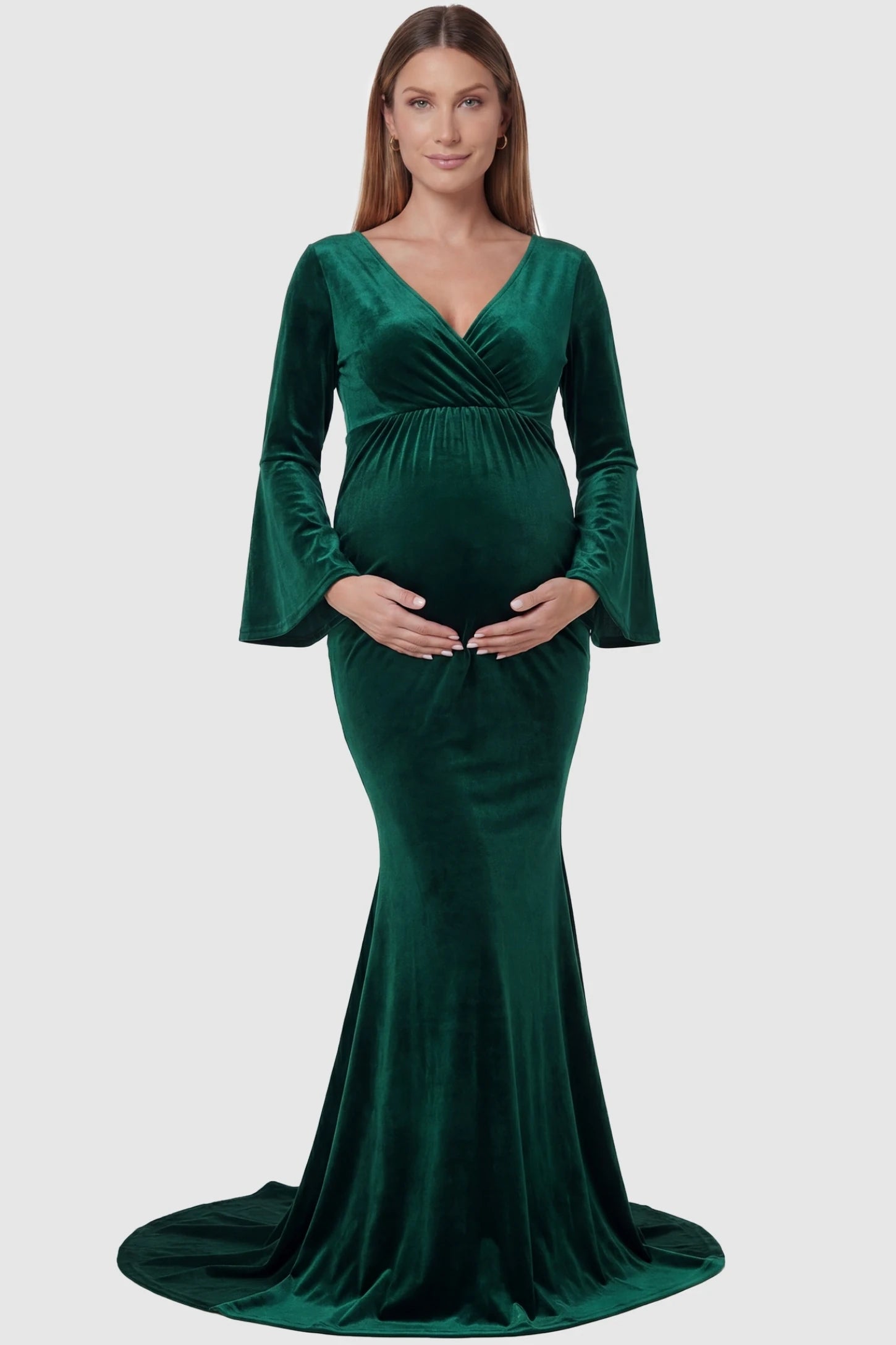 Velvet Long Bell Sleeve Maternity Mermaid Gown Velvet Long Bell Sleeve Maternity Mermaid Gown in Green featuring a front-facing pregnant silhouette with a long train.